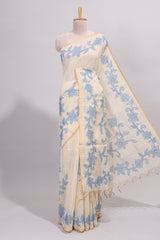 Cream floral design linen cotton saree with self zari border and matching printed blouse