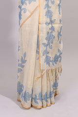 Cream floral design linen cotton saree with self zari border and matching printed blouse