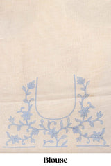 Cream floral design linen cotton saree with self zari border and matching printed blouse