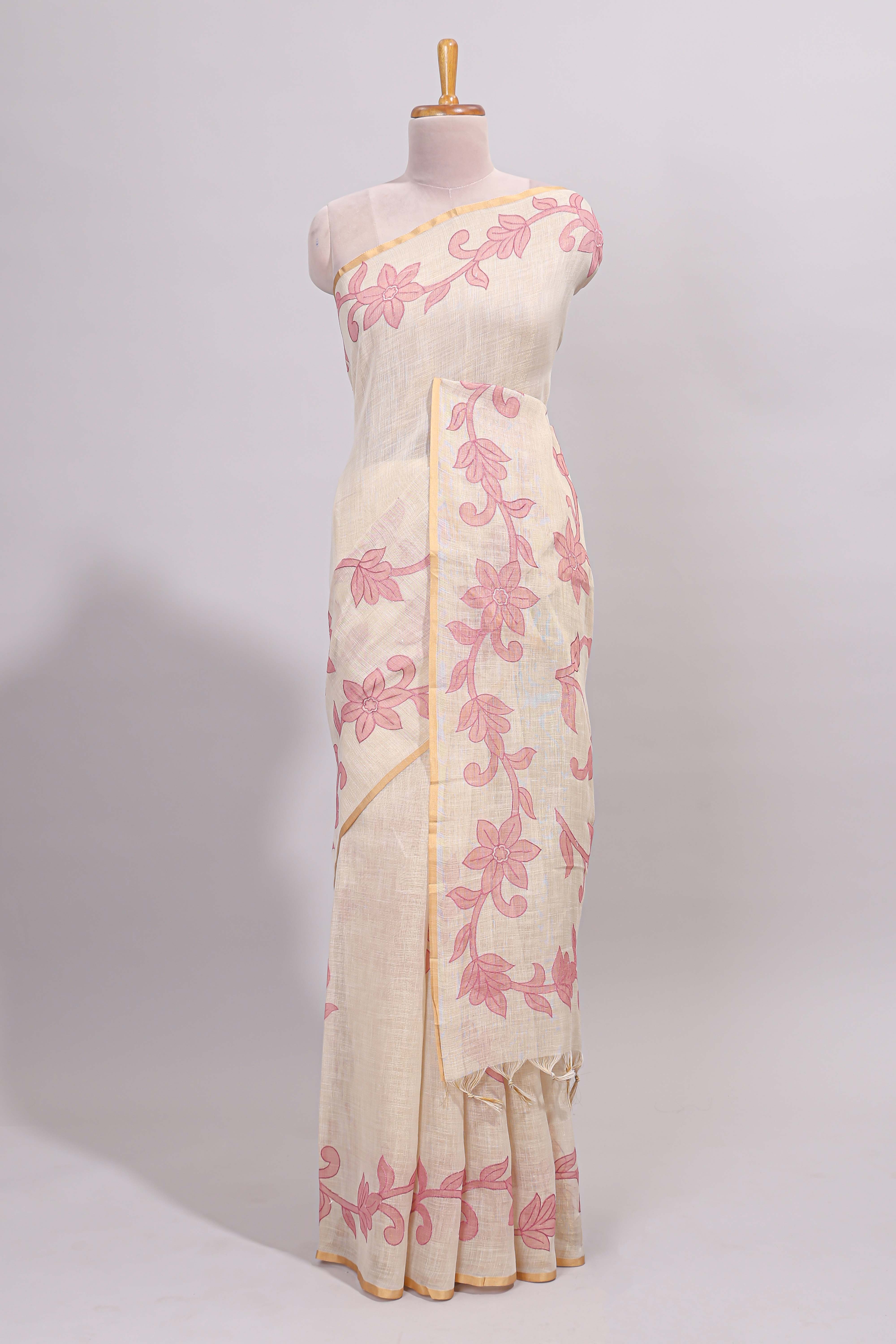 Cream floral design linen cotton saree with self zari border and matching printed blouse
