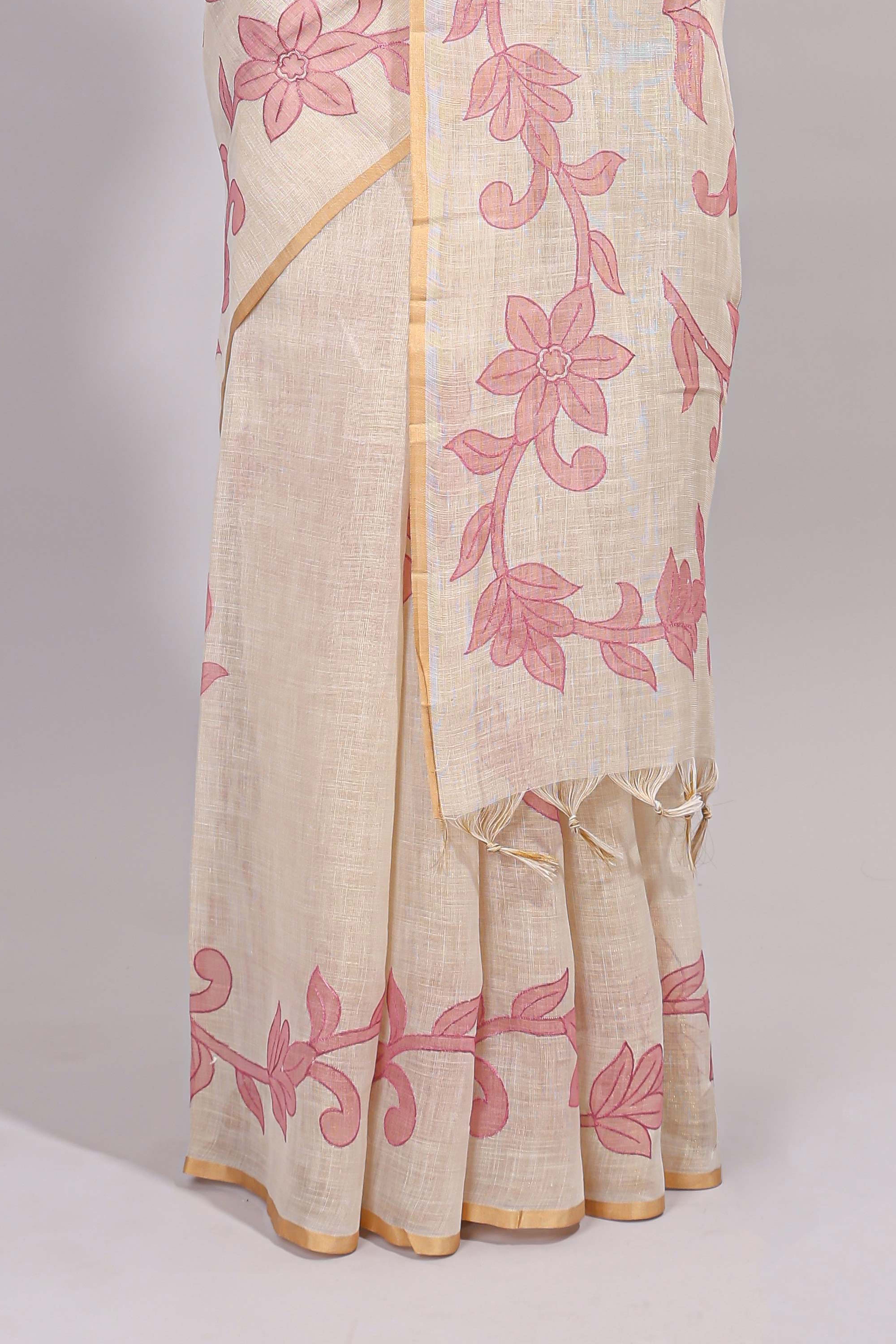 Cream floral design linen cotton saree with self zari border and matching printed blouse