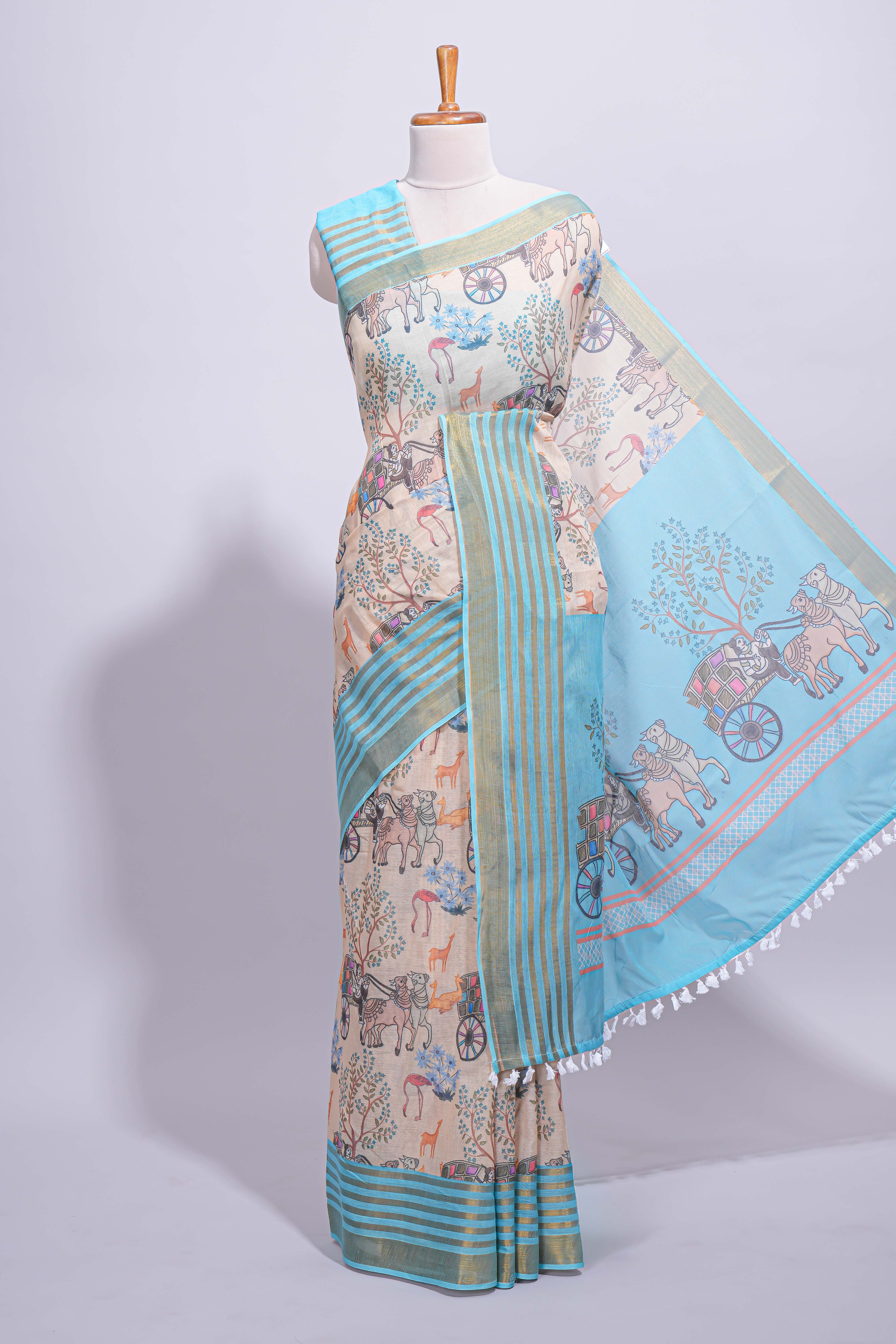 Pastel blue and beige linen cotton saree with animal motifs striped zari border and printed pallu with tassel along with contrast blouse