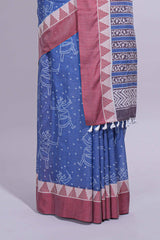 Blue linen small dotted elephant and floral motifs contrast border and printed pallu with geometric patterns and tassel detailing along with printed blouse