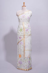 White linen saree delicate floral prints with pastel accents by a subtle gold zari border andstriped pallu with tasselalong with self blouse