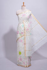 White linen saree floral prints with pastel accents by a subtle gold zari border andstriped pallu with tasselalong with self blouse
