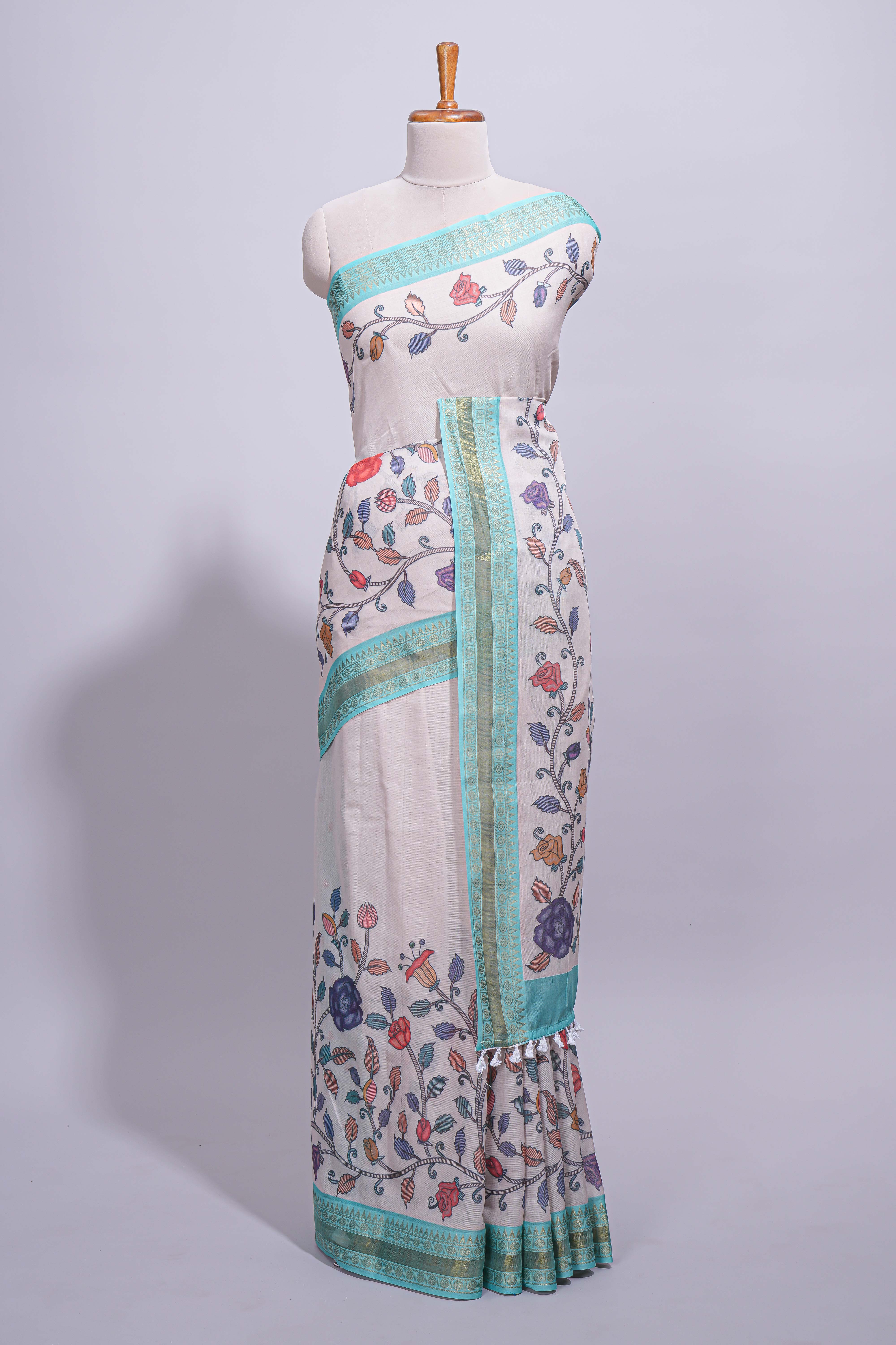 Elegant linen cotton saree with multicolourfloral vine print with a contrast border and printed pallu along with printed blouse