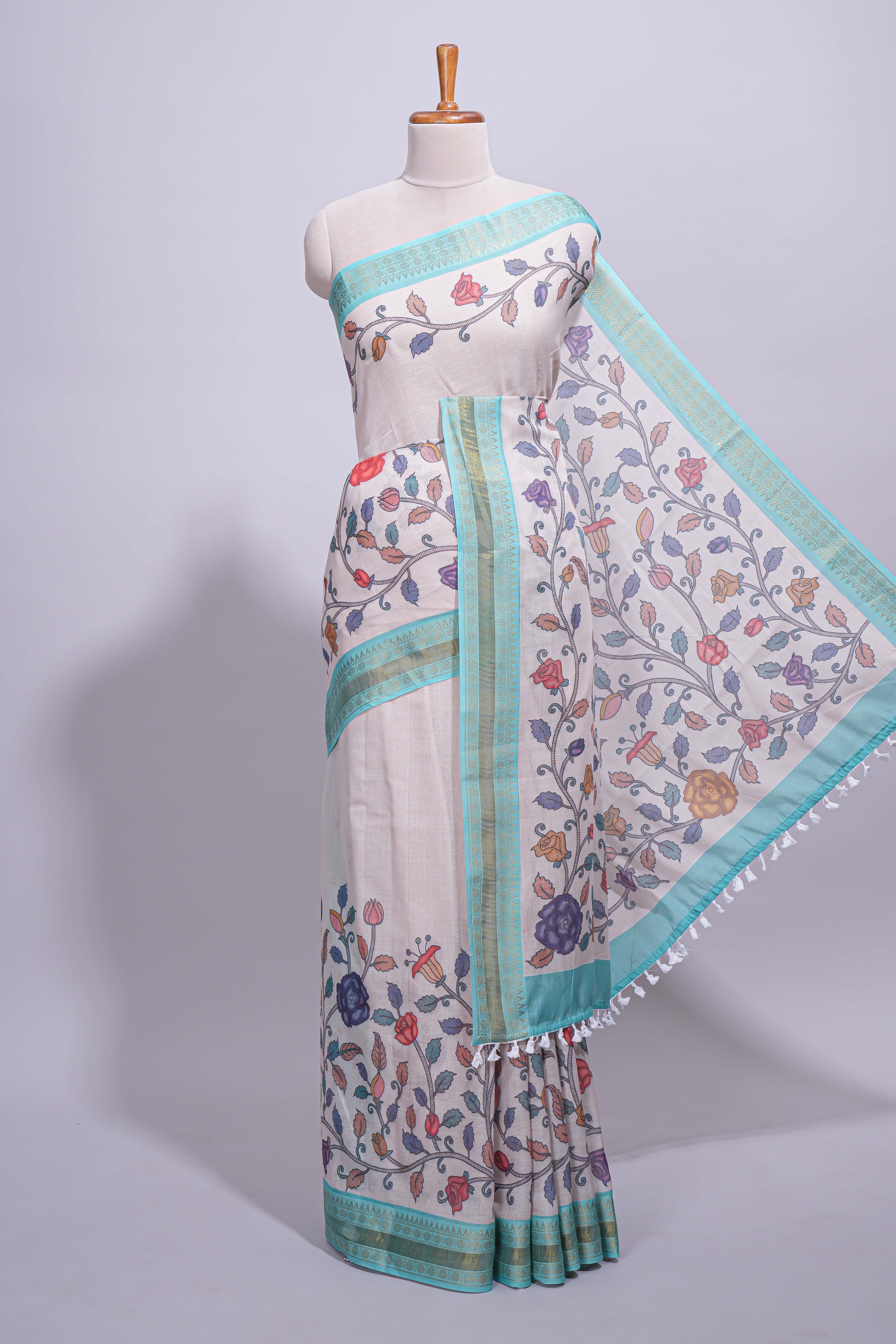 Elegant linen cotton saree with multicolourfloral vine print with a contrast border and printed pallu along with printed blouse
