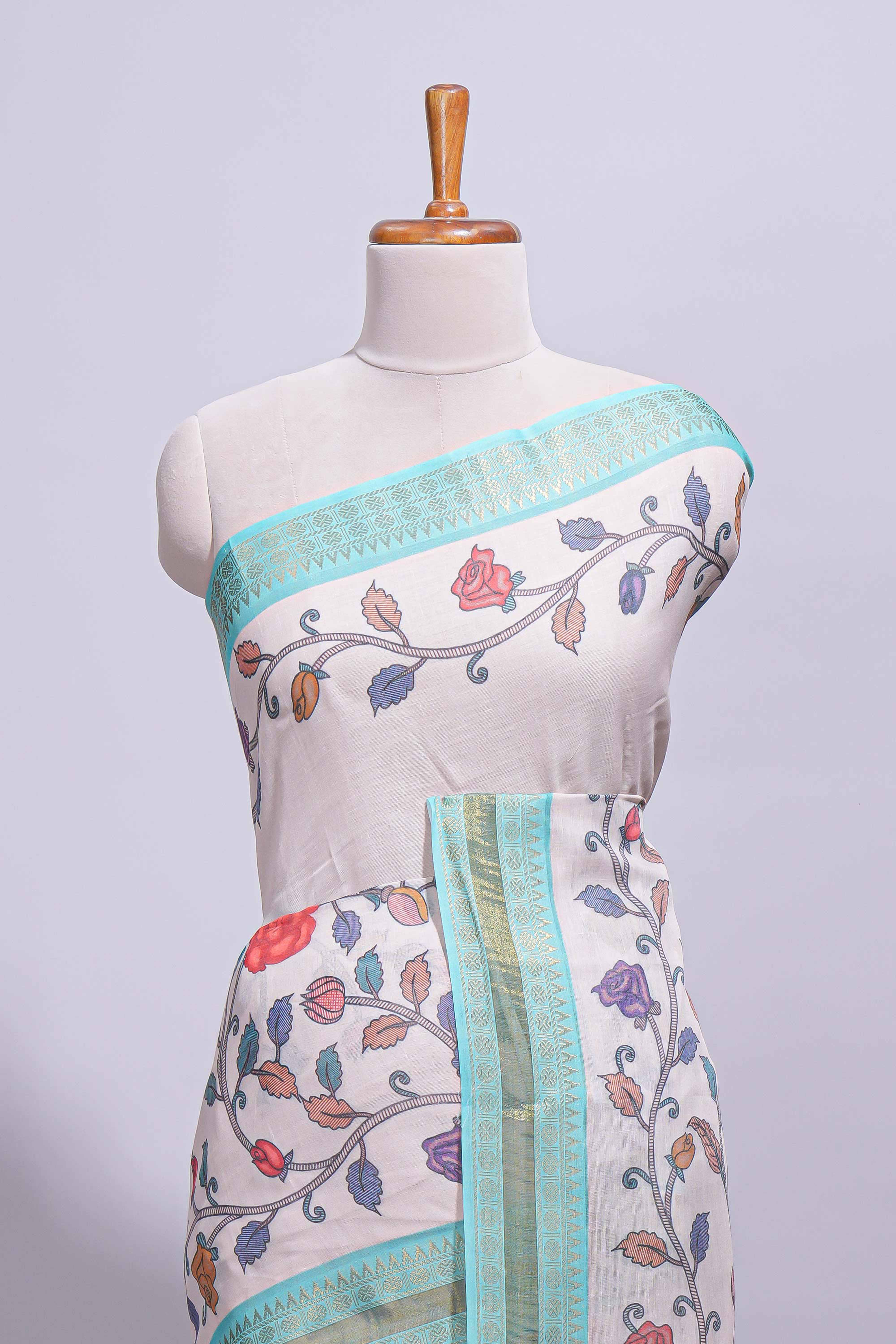 Elegant linen cotton saree with multicolourfloral vine print with a contrast border and printed pallu along with printed blouse