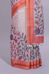 Ivory with orange linen cotton saree with multicolourfloral vine print with a contrast border and printed pallu along with printed blouse
