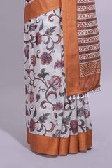 White with orange linen cotton saree with multicolourfloral vine print with a contrast border and printed pallu along with printed blouse