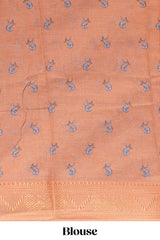 White with orange linen cotton saree with multicolourfloral vine print with a contrast border and printed pallu along with printed blouse