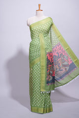 Green linen saree white polka dot pattern all over the body and self zari border with printed pallu along with printed blouse