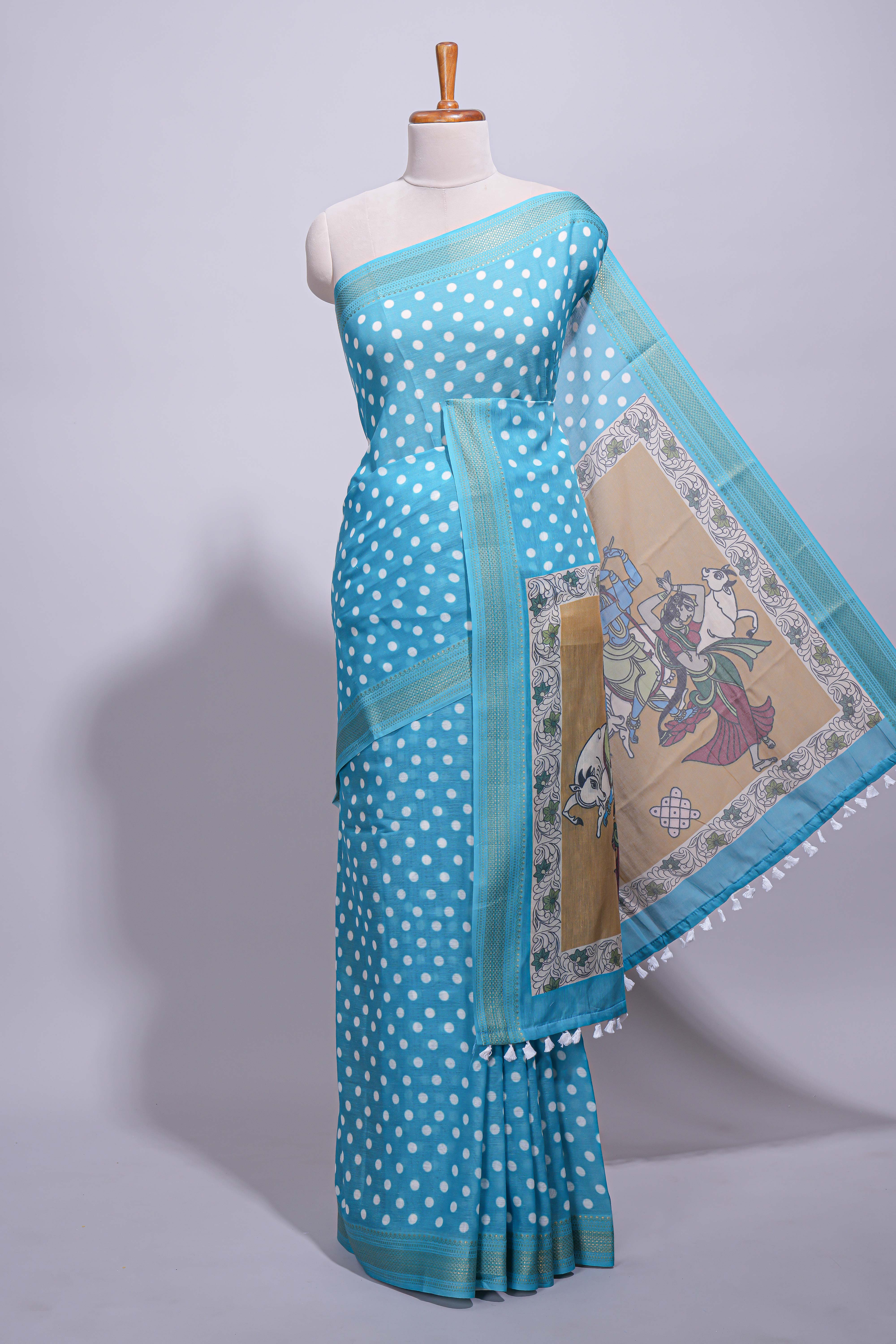 Blue linen saree white polka dot pattern all over the body and self zari border with printed pallu along with printed blouse