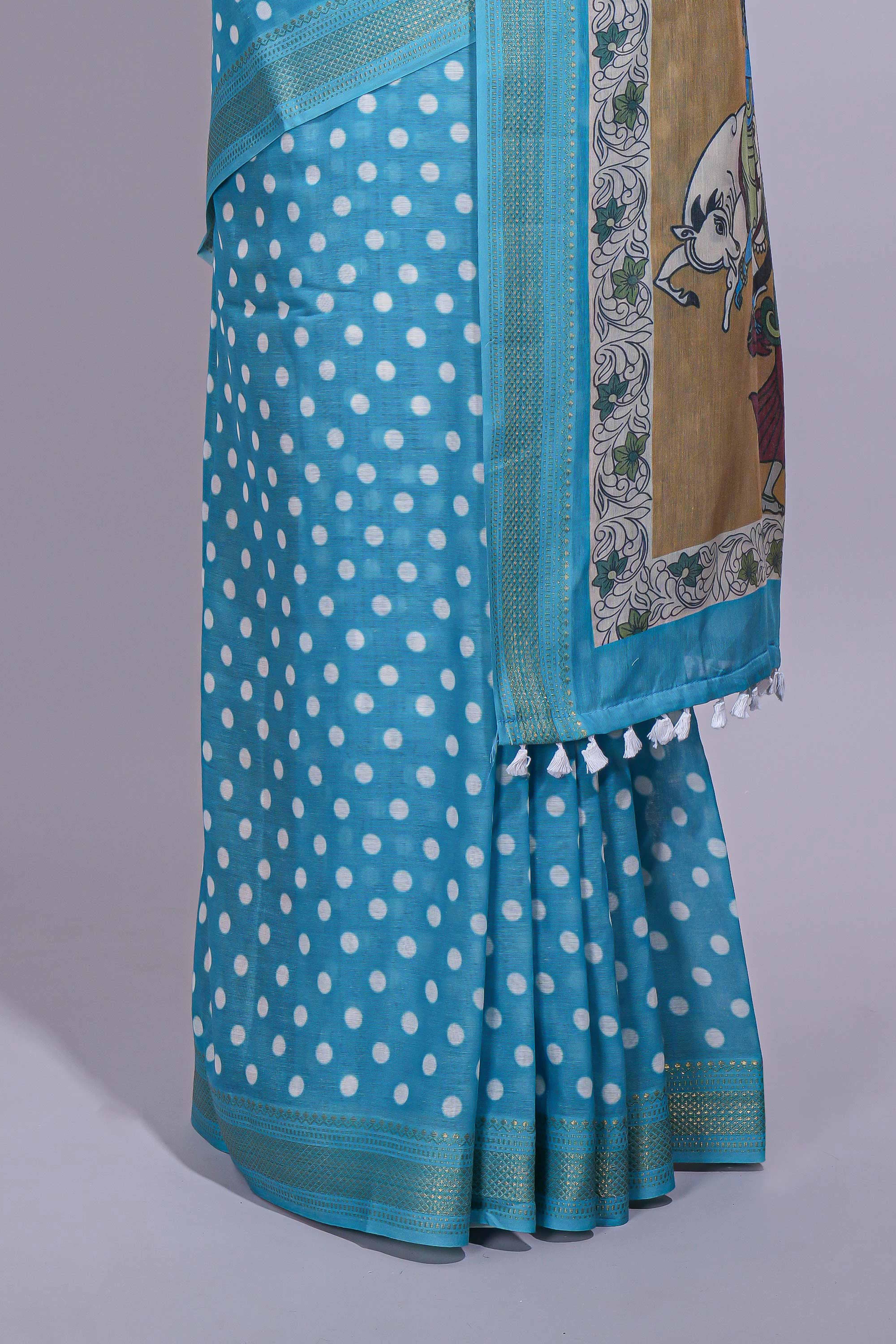 Blue linen saree white polka dot pattern all over the body and self zari border with printed pallu along with printed blouse