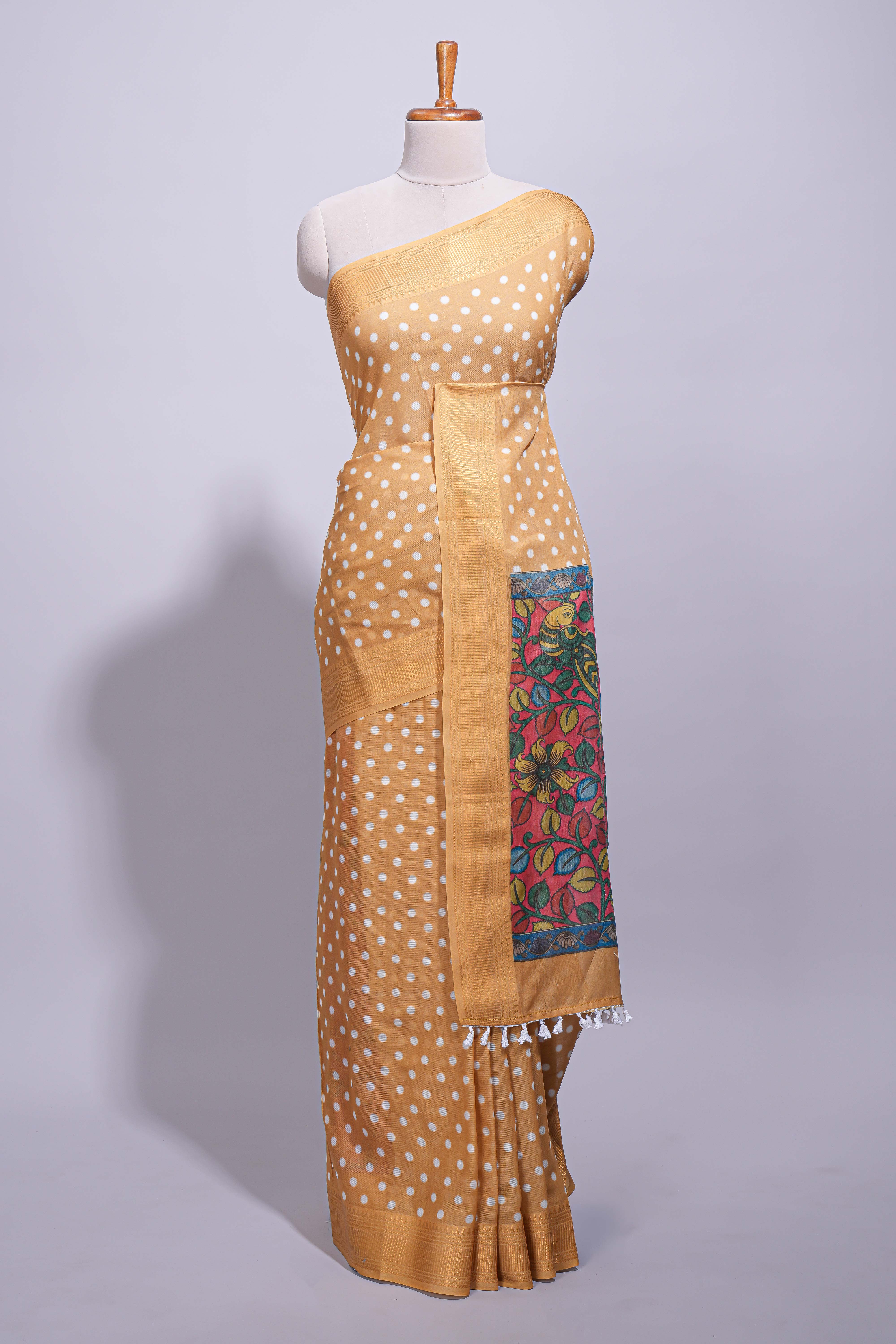 Mustard yellow linen saree white polka dot pattern all over the body and self zari border with printed pallu along with printed blouse