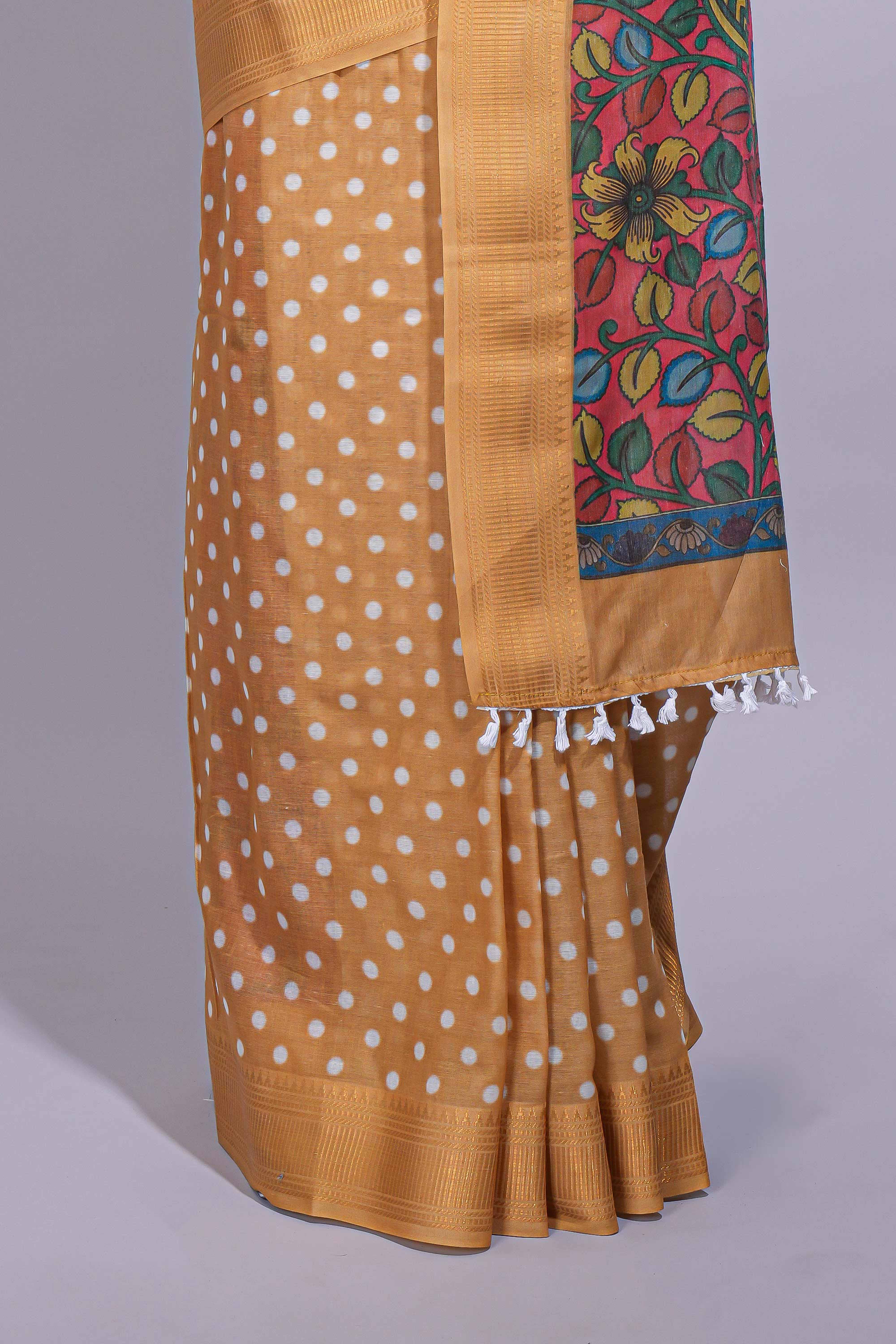 Mustard yellow linen saree white polka dot pattern all over the body and self zari border with printed pallu along with printed blouse