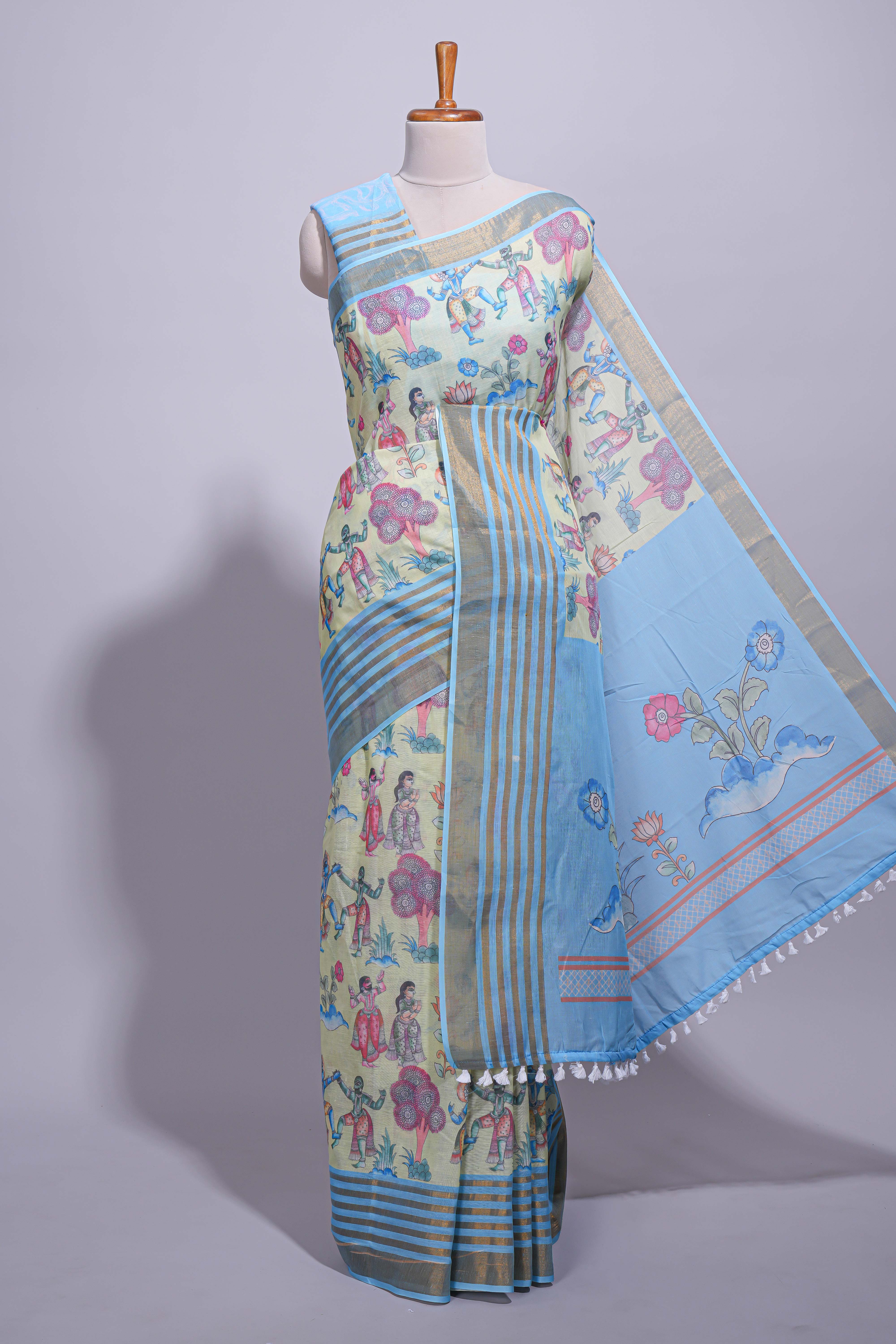 Pastel blue and ivory linen cotton saree with animal motifs striped zari border and printed pallu with tassel along with contrast blouse