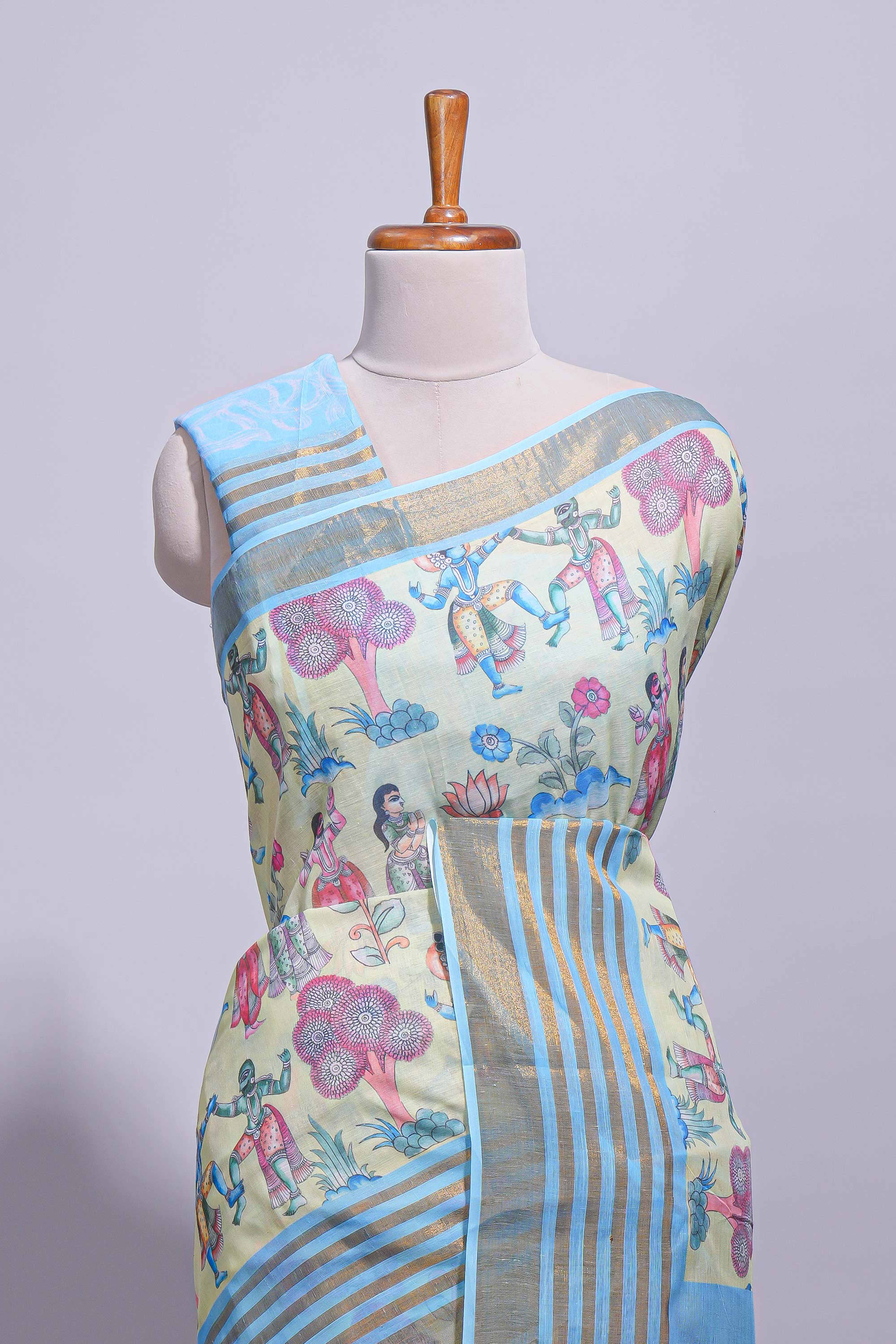 Pastel blue and ivory linen cotton saree with animal motifs striped zari border and printed pallu with tassel along with contrast blouse