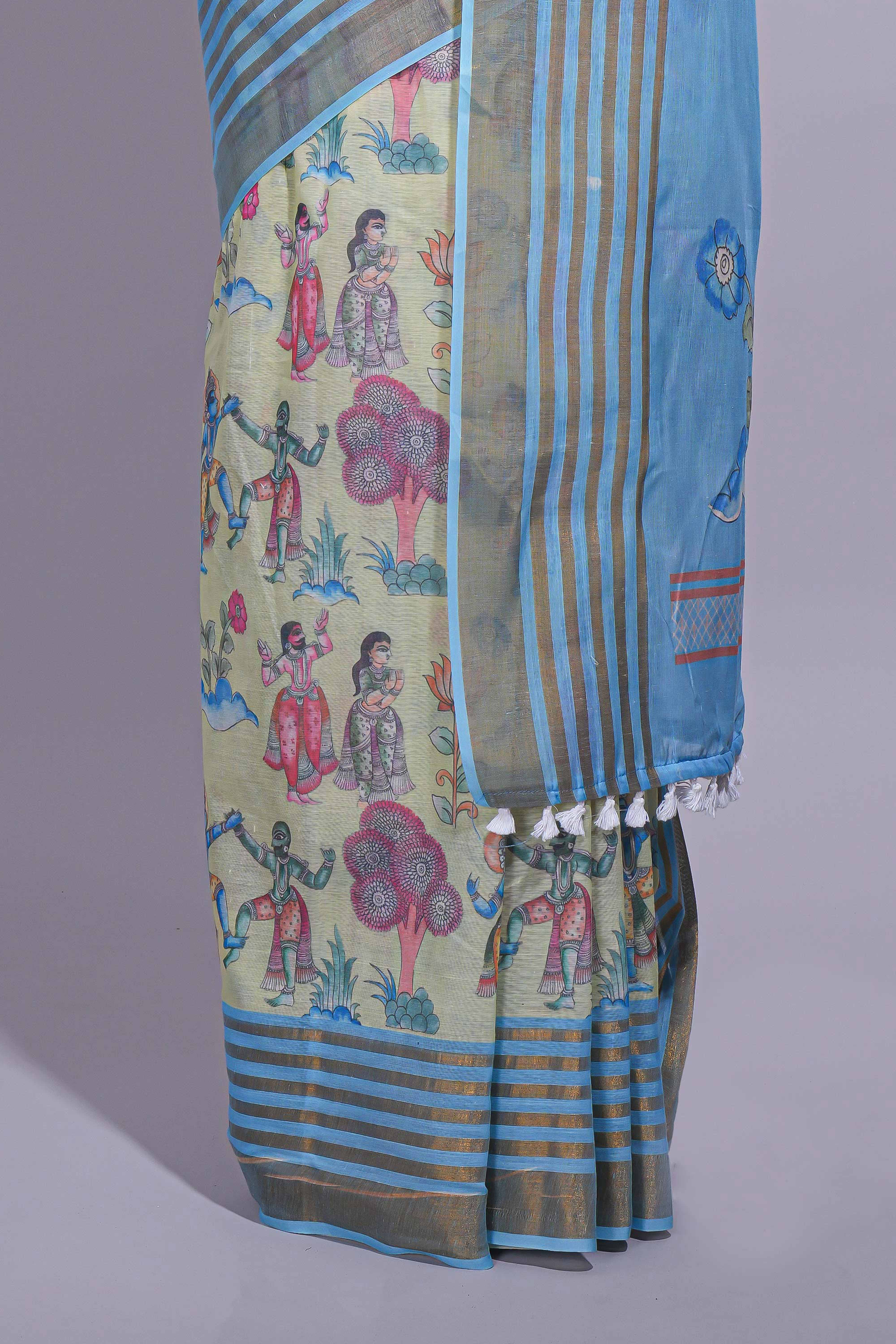Pastel blue and ivory linen cotton saree with animal motifs striped zari border and printed pallu with tassel along with contrast blouse