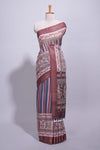 Maroon linen saree with vertical stripe patterns and traditional floral artistic motifs with intricate printed borders along with contrast blouse piece