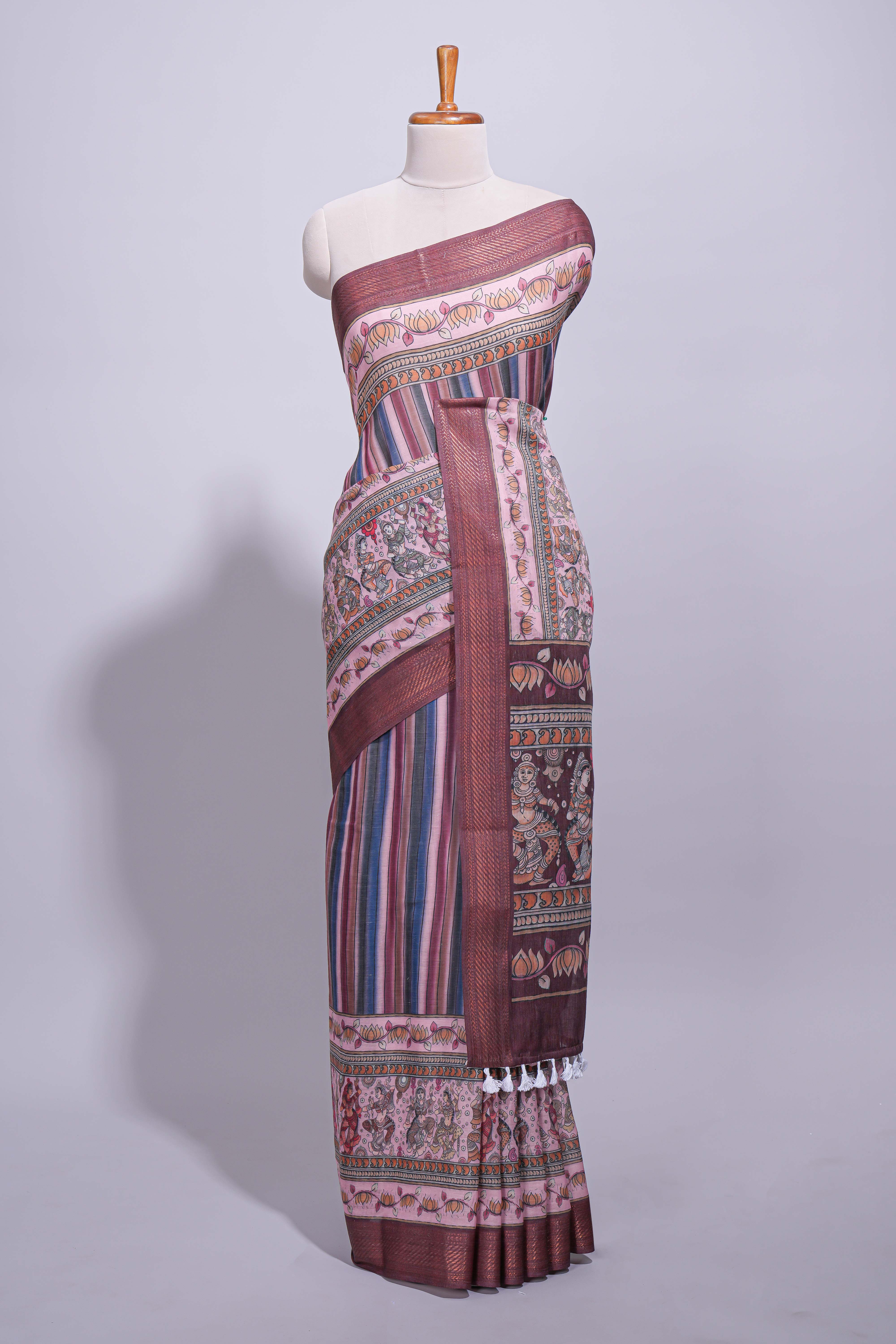 Maroon linen saree with vertical stripe patterns and traditional floral artistic motifs with intricate printed borders along with contrast blouse piece