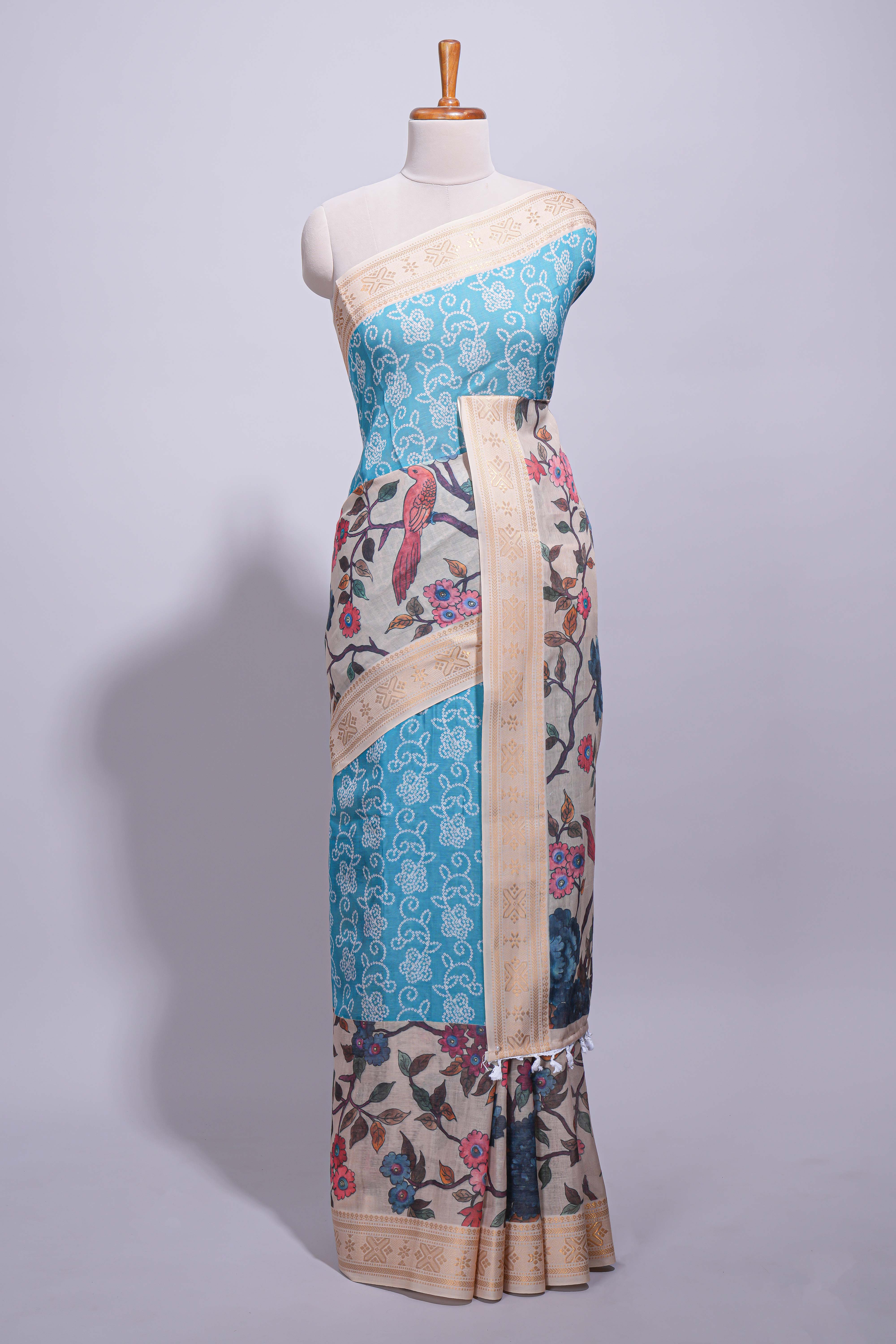 Linen saree with a blue with beige featuring floral patterns with a contrastfloral printed pallu and zari border with tassel