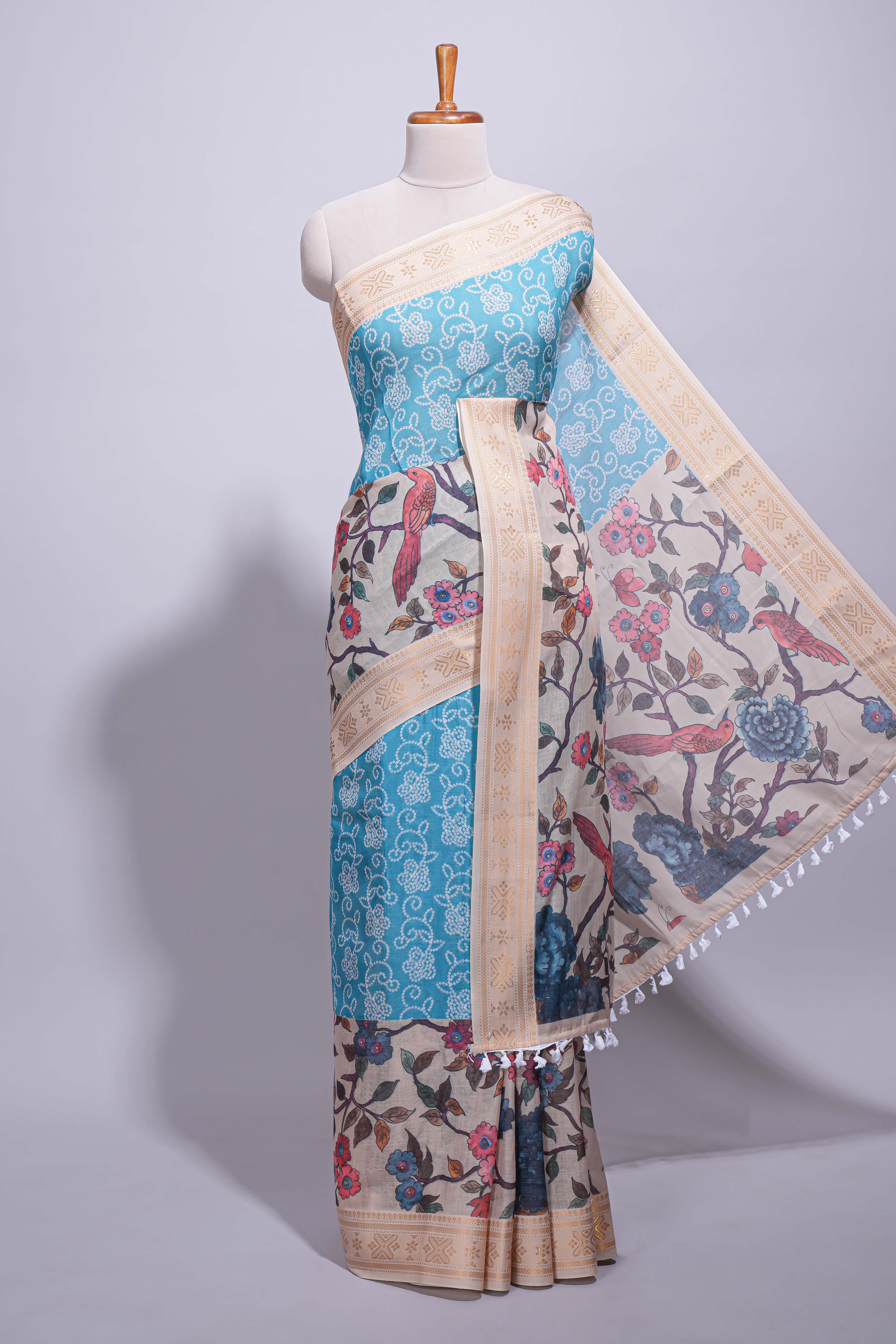Linen saree with a blue with beige featuring floral patterns with a contrastfloral printed pallu and zari border with tassel