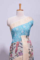 Linen saree with a blue with beige featuring floral patterns with a contrastfloral printed pallu and zari border with tassel