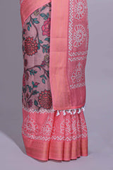 Linen saree with a pink colourfeaturing floral patterns with a contrastfloral printed pallu and zari border with tassel along with contrast blouse