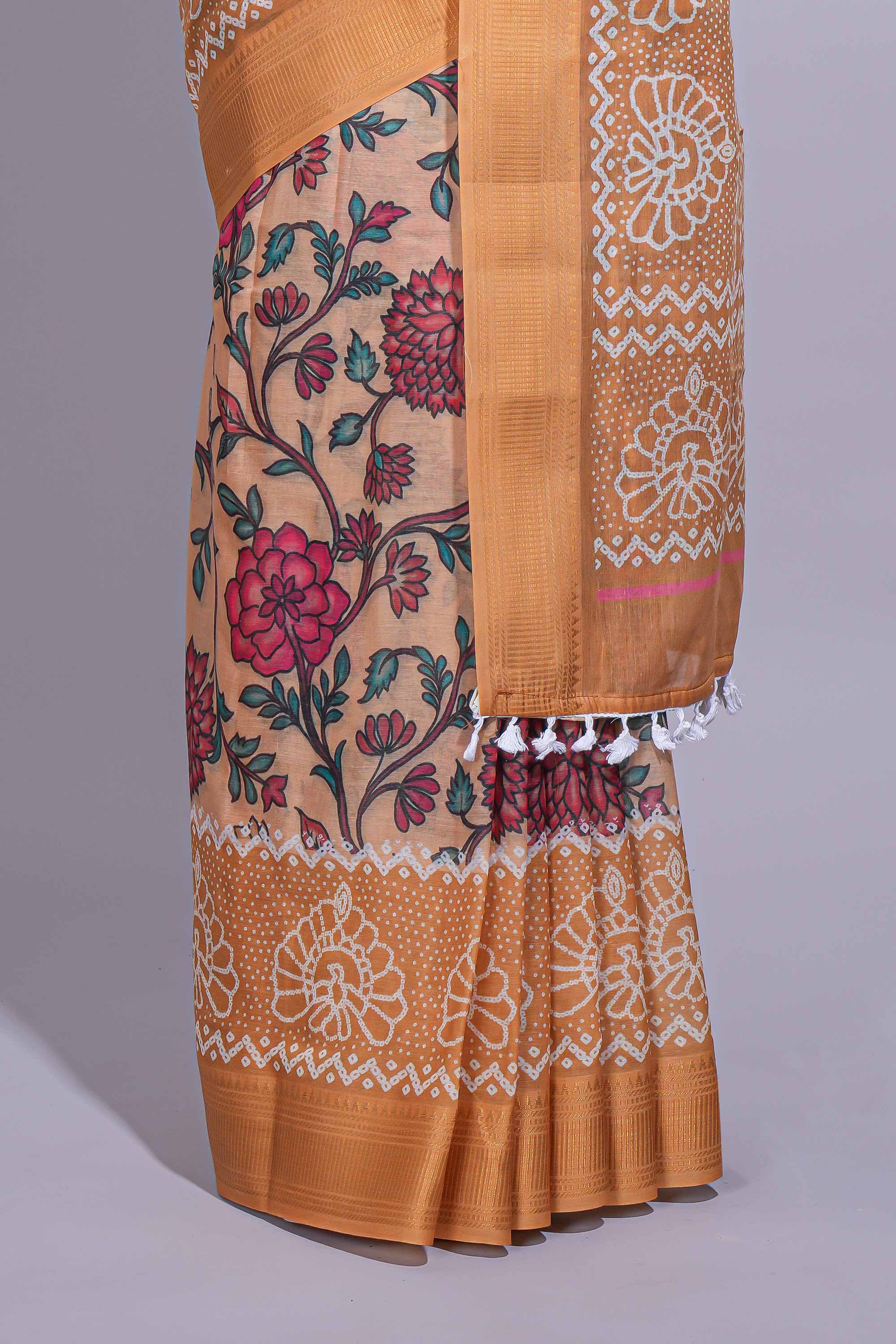 Linen saree with a orange colourfeaturing floral patterns with a contrastfloral printed pallu and zari border with tassel along with contrast blouse