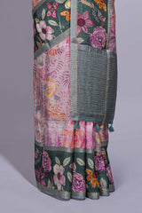 Soft pink linen saree with floral print highlighted with a contrast floral pallu and metallic zari border along with contrast blouse piece