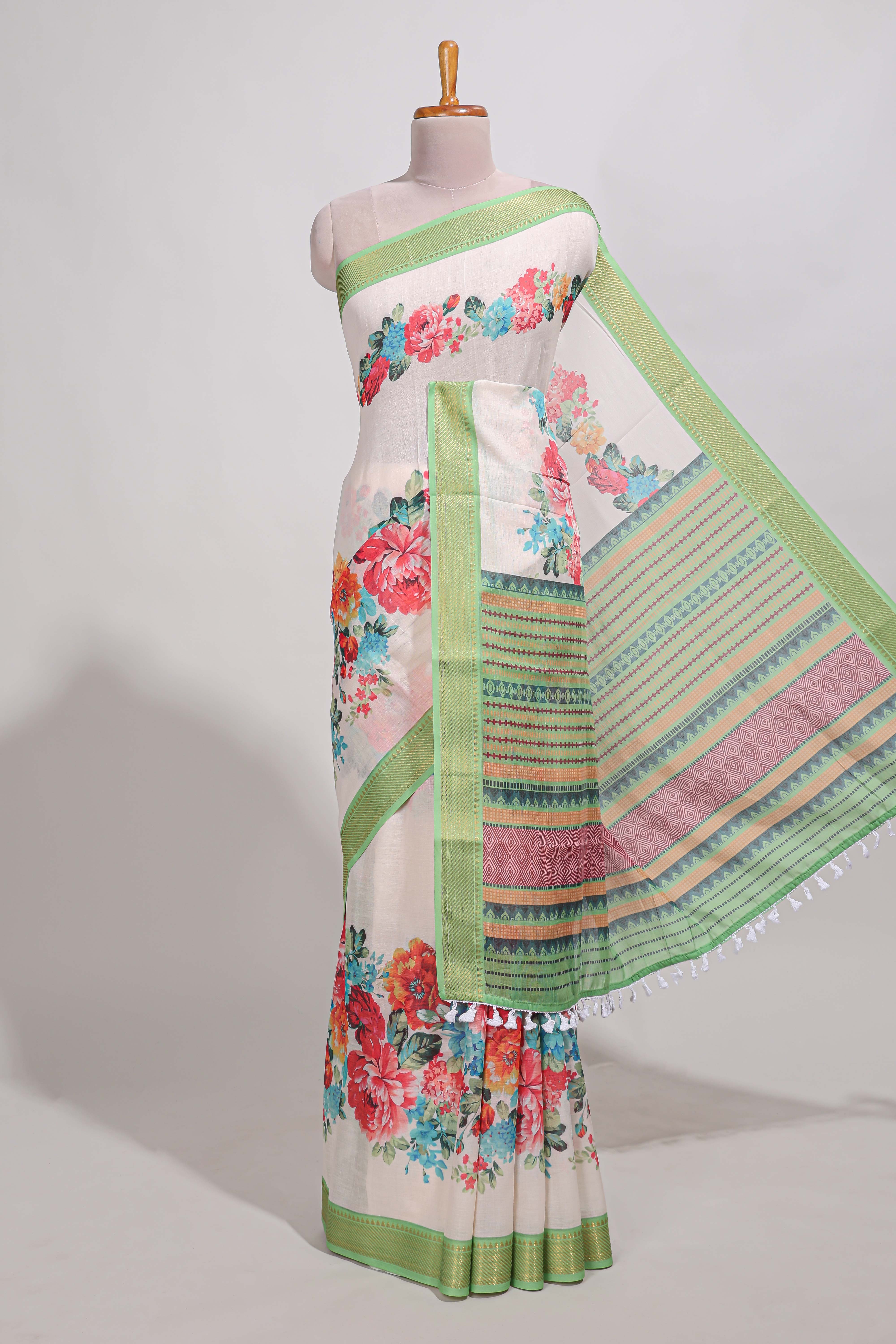 plainlinen cotton saree with floral printed border andfloral buttaprinted blouse