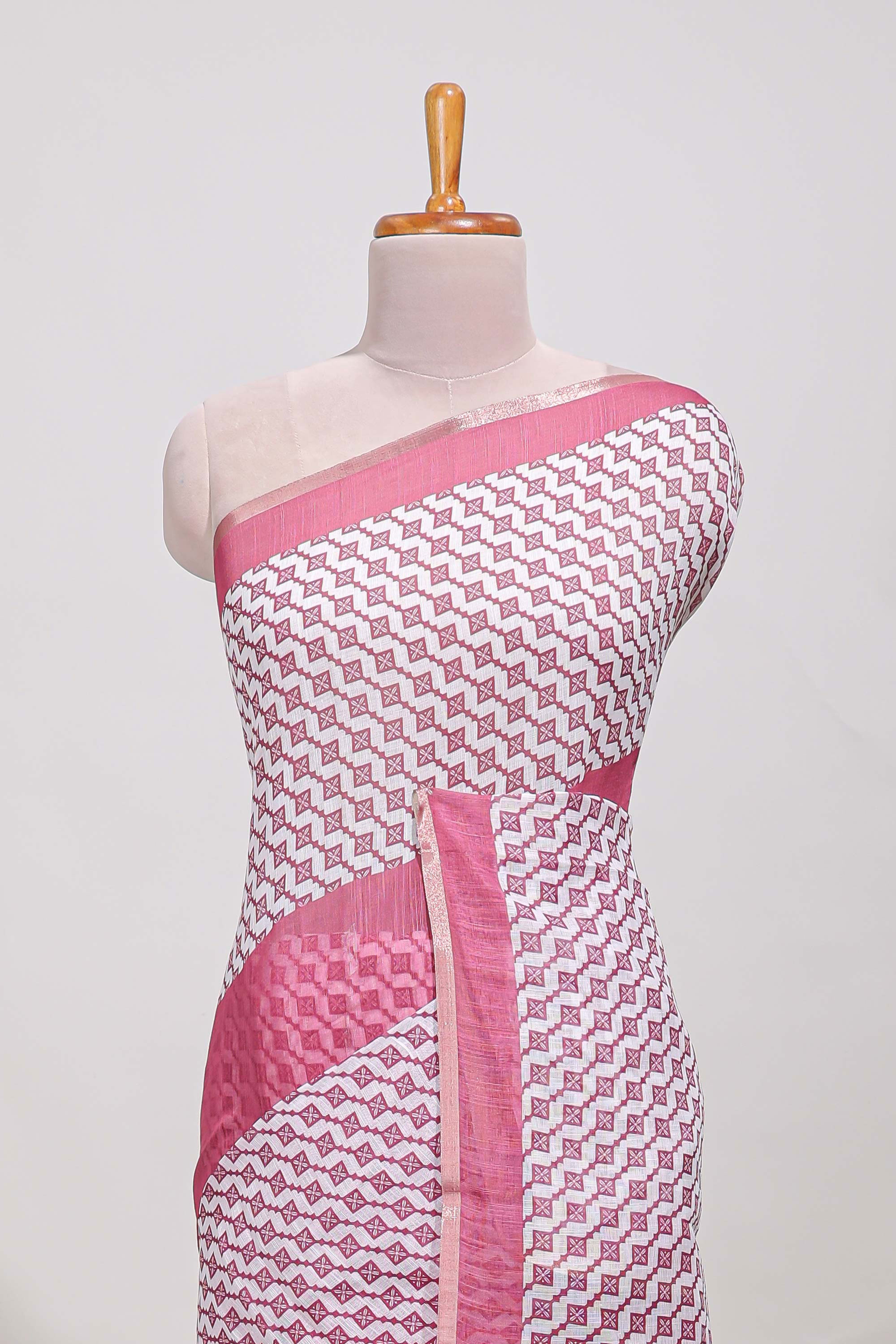 White and pink geomentric printed linen cotton saree with matching blouse and printed pallu