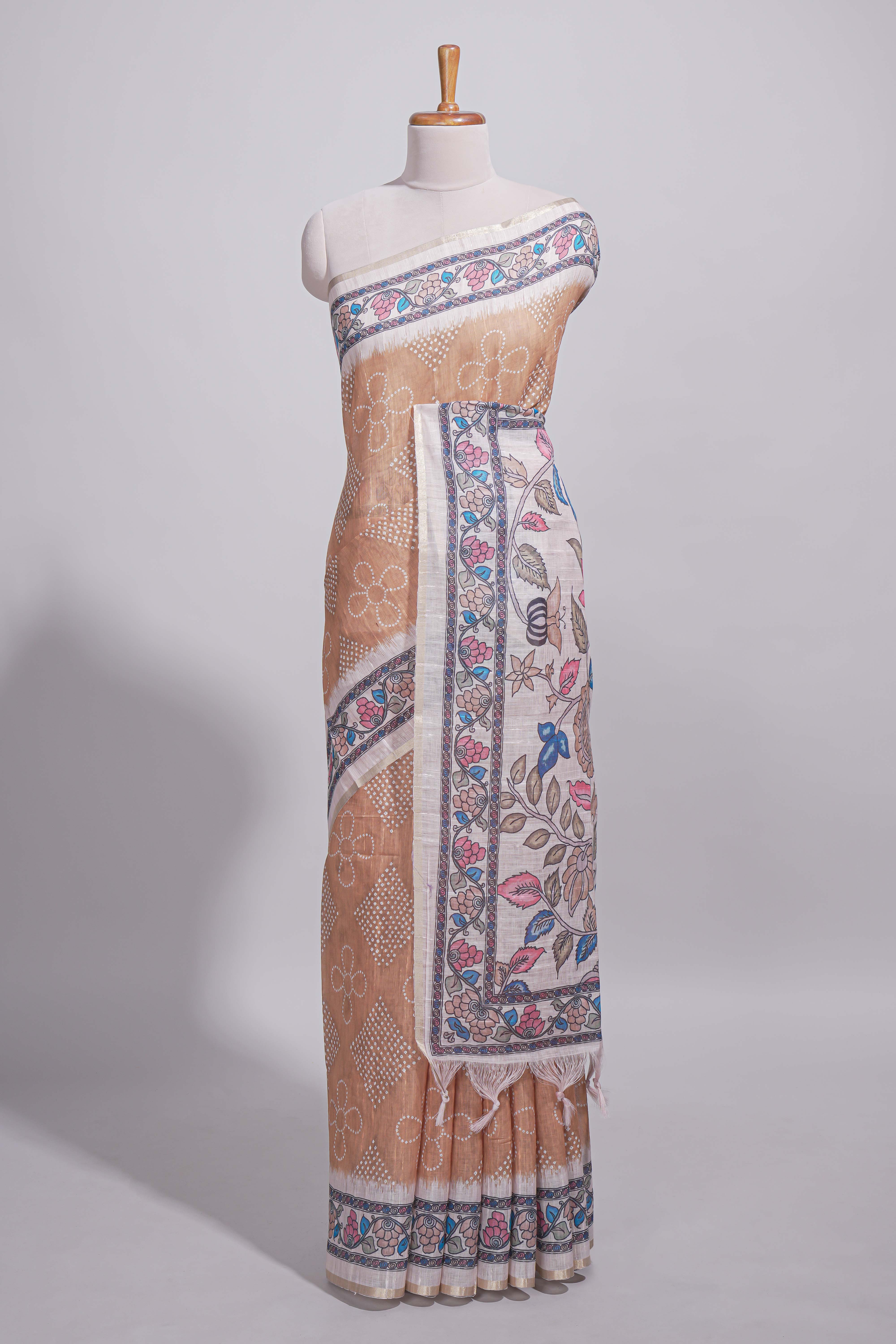 Beige color linen saree with floral and geometric prints multicolour floral border andprinted pallu with tassels with a contrast blouse piece