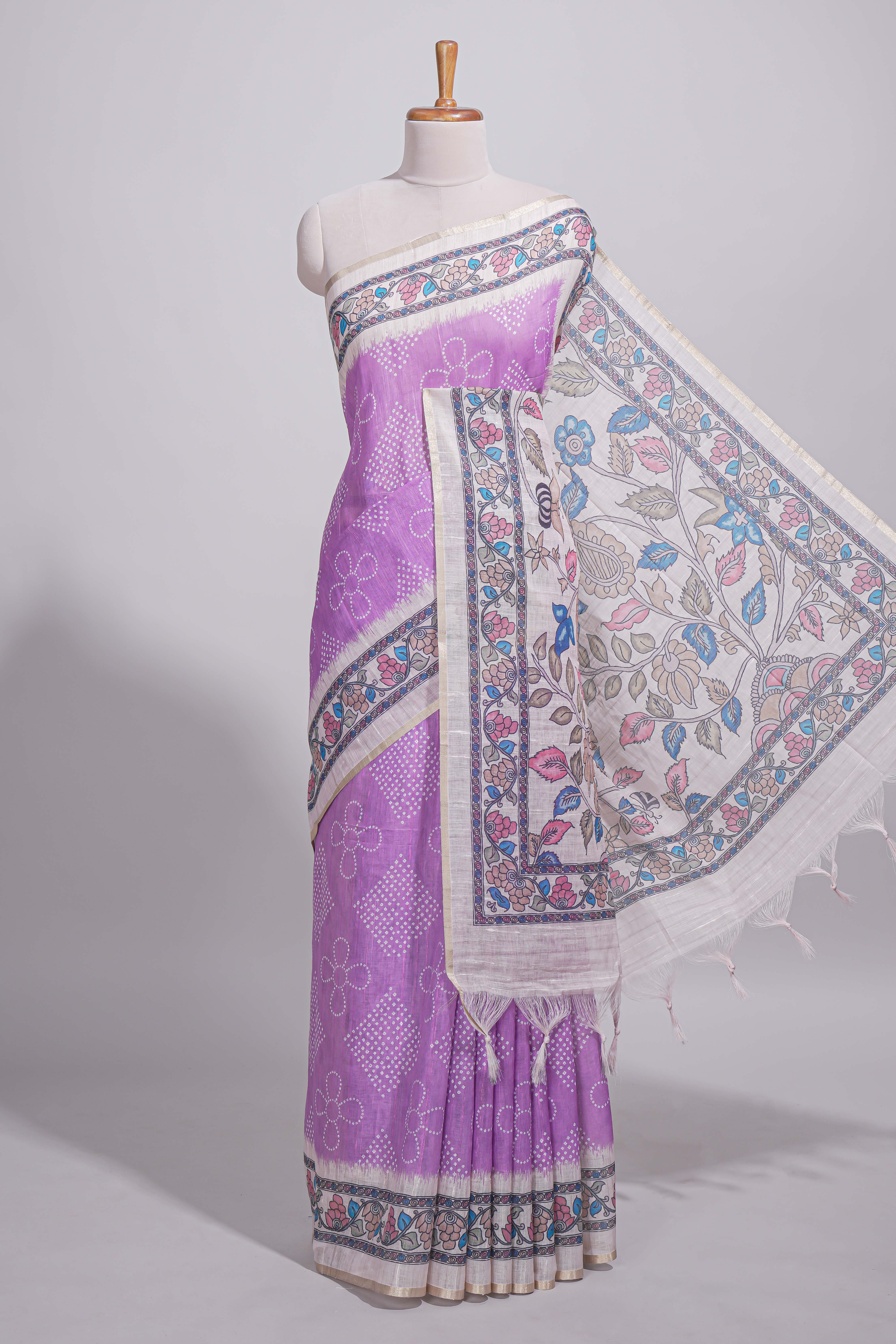 Lavender color linen saree with floral and geometric prints multicolour floral border andprinted pallu with tassels with a contrast blouse piece