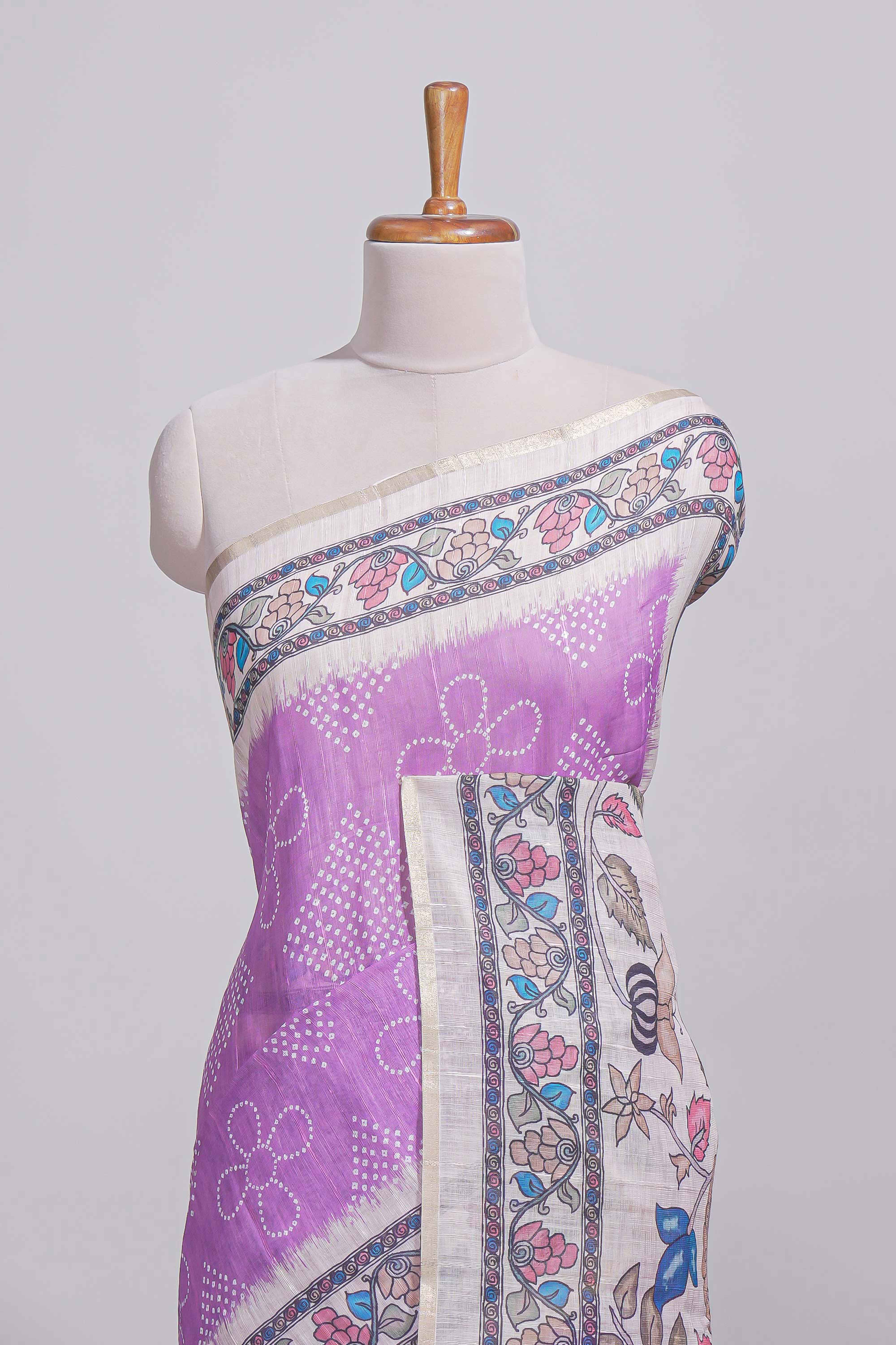 Lavender color linen saree with floral and geometric prints multicolour floral border andprinted pallu with tassels with a contrast blouse piece