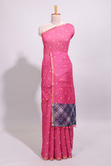 Pink round motifs linen saree with self zari border and contrast checked blouse
