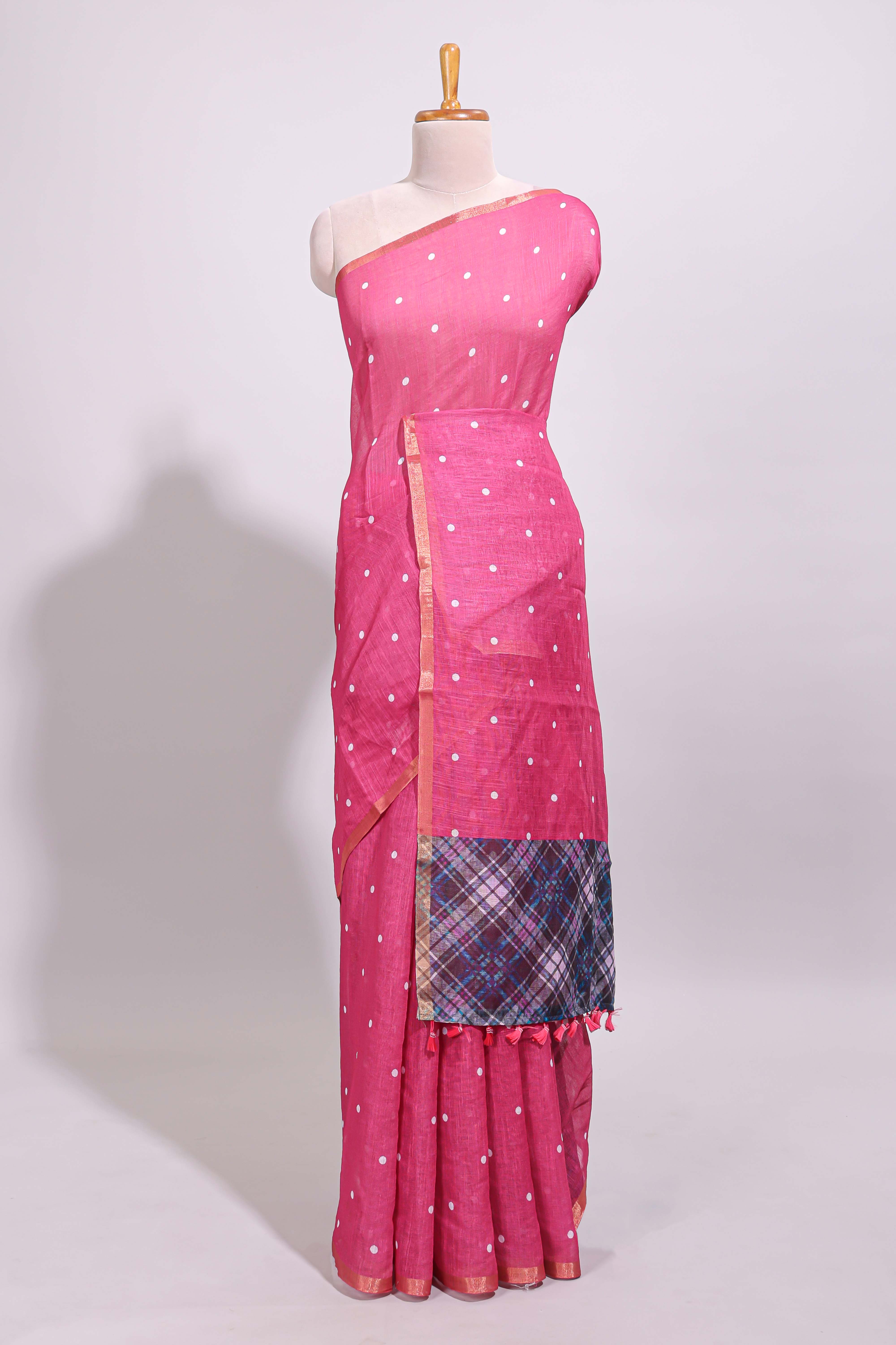 Pink round motifs linen saree with self zari border and contrast checked blouse