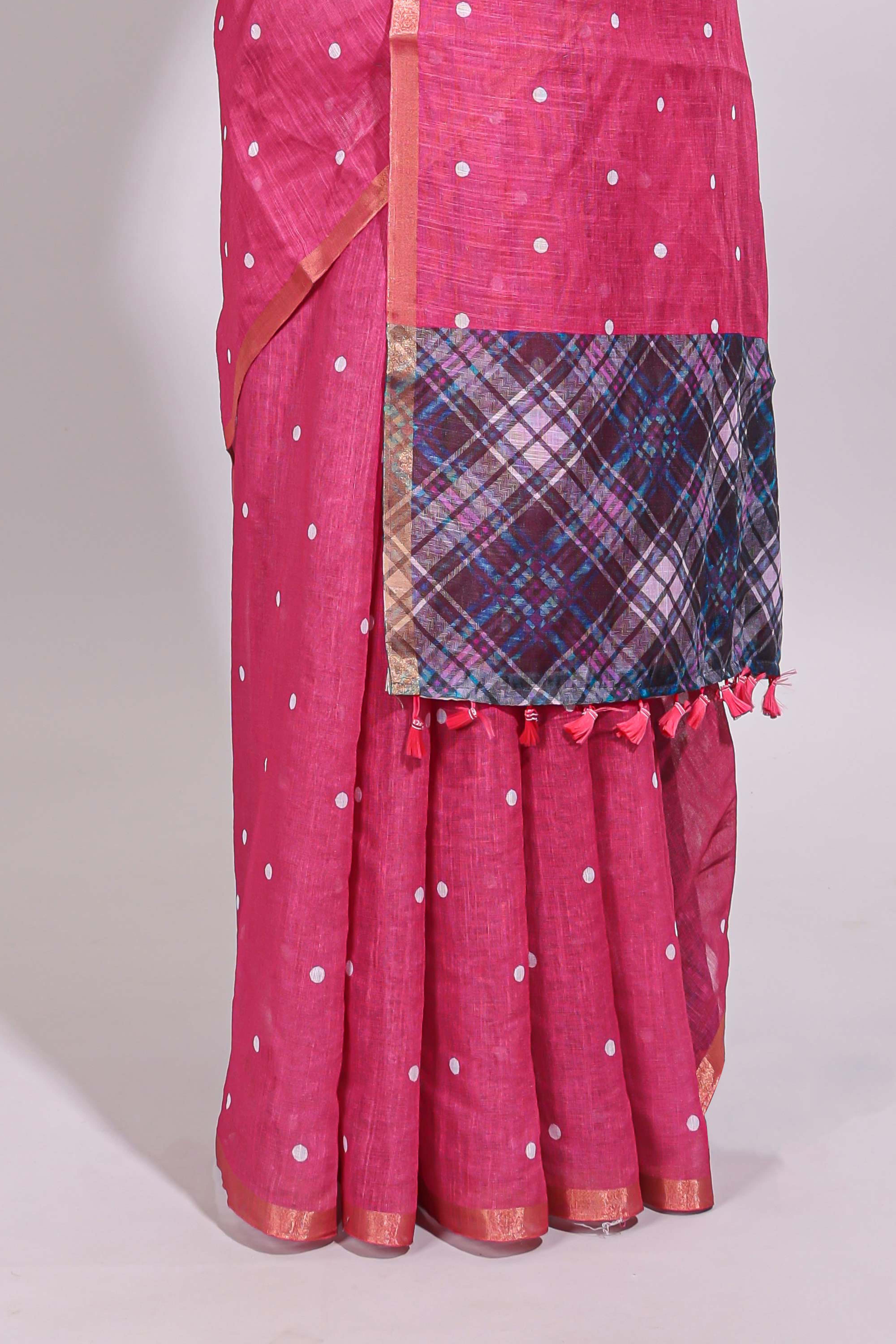 Pink round motifs linen saree with self zari border and contrast checked blouse