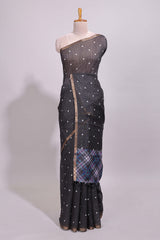 Black round motifs linen saree with self zari border and contrast checked blouse
