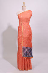 Orange round motifs linen saree with self zari border and contrast checked blouse