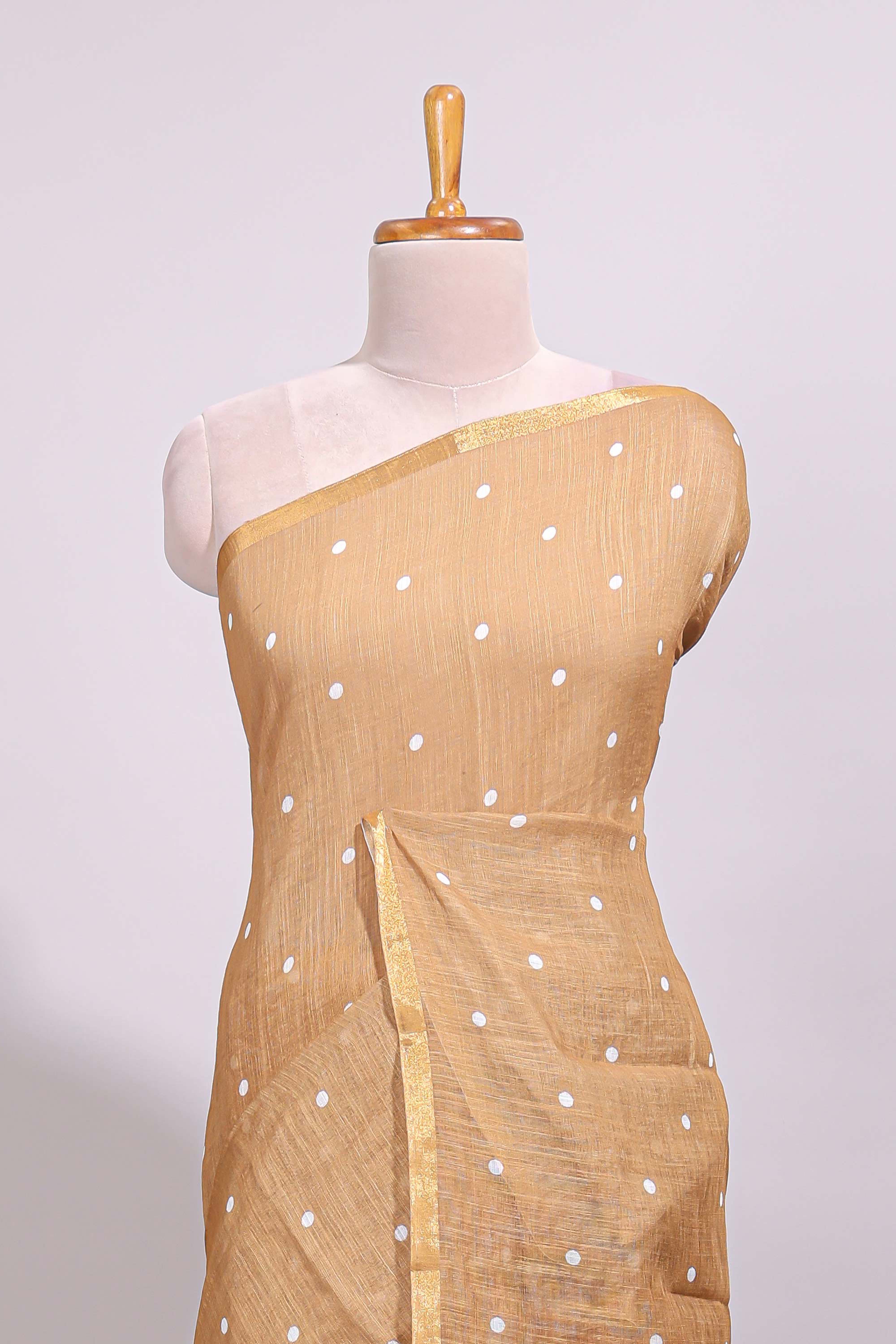Sandal round motifs linen saree with self zari border and contrast checked blouse