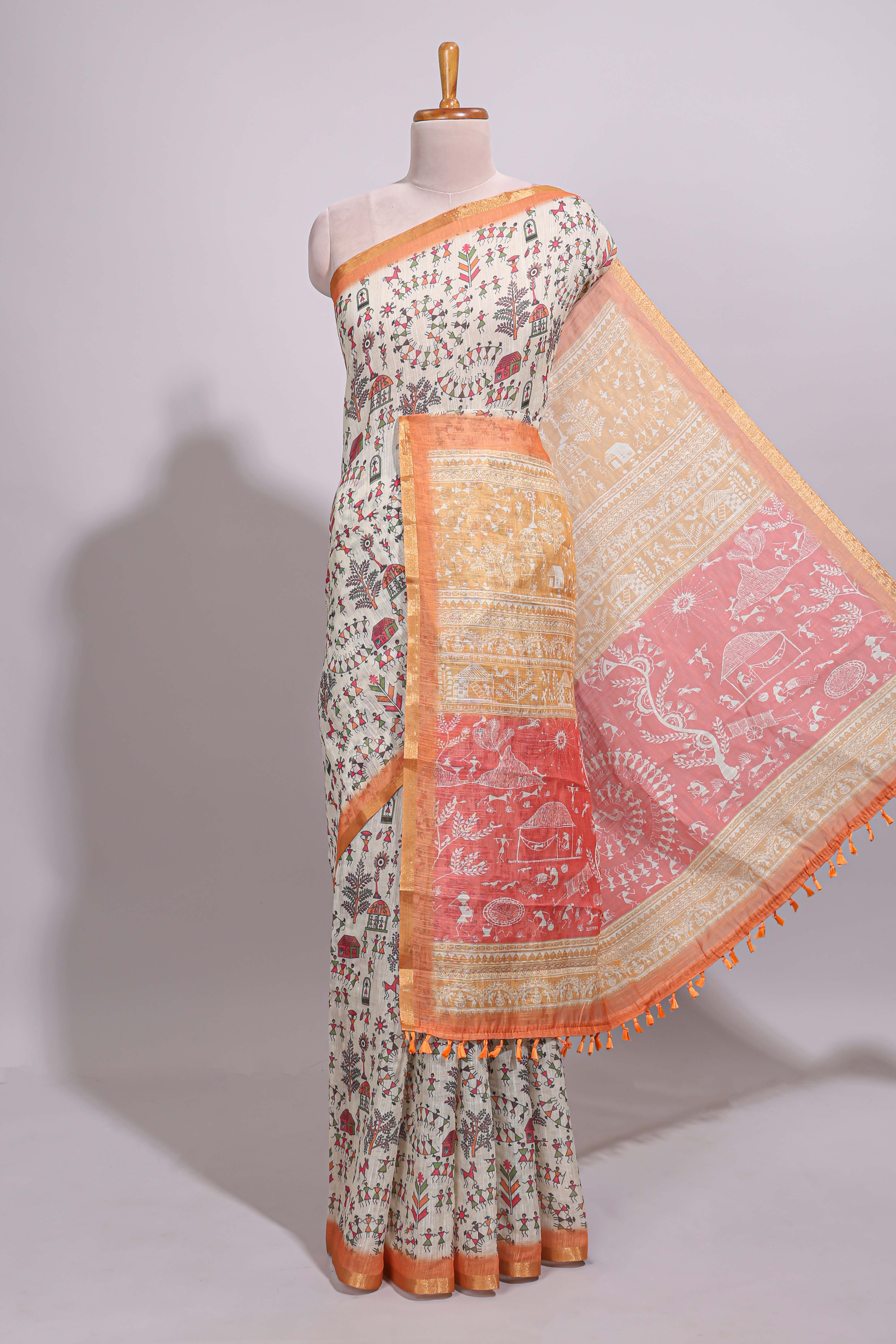 Cream warli design linen cotton saree with contrast zari border and contrast printed blouse