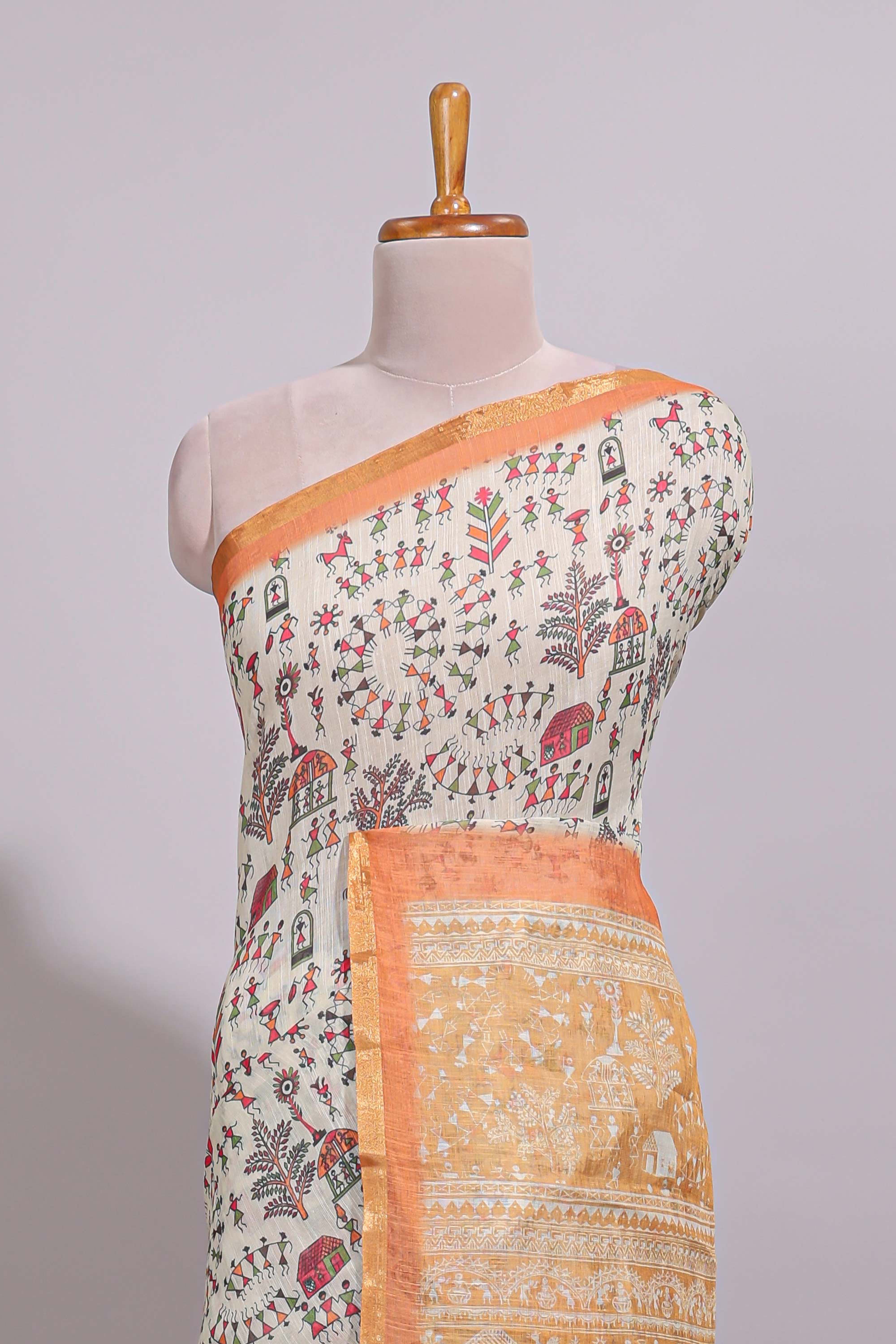 Cream warli design linen cotton saree with contrast zari border and contrast printed blouse