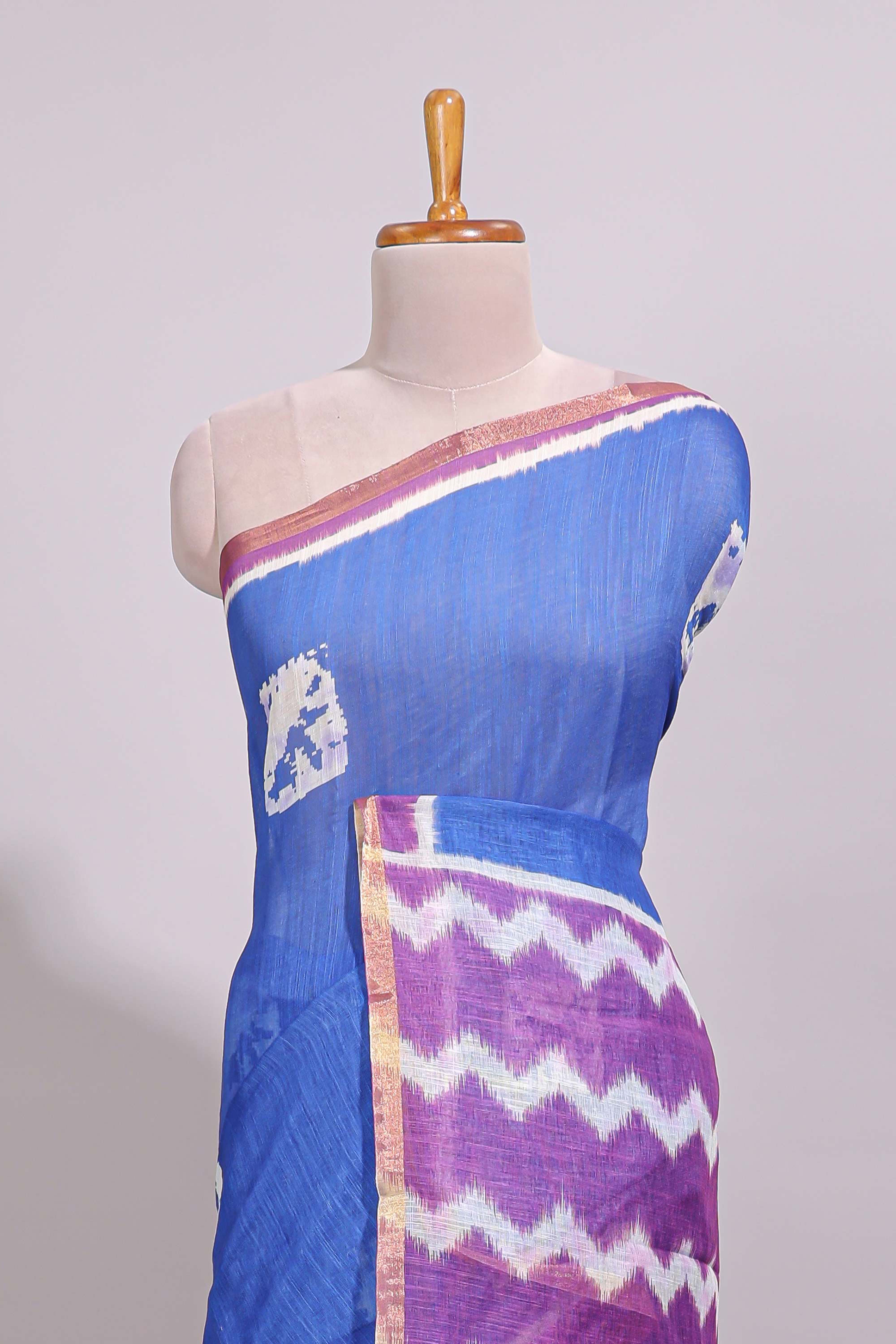 Blue geometric butta design linen cotton saree with contrast border and chevron design pallu