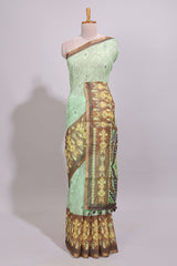 Green geometric ikkat design linen cotton saree with contrast zari border and printed blouse