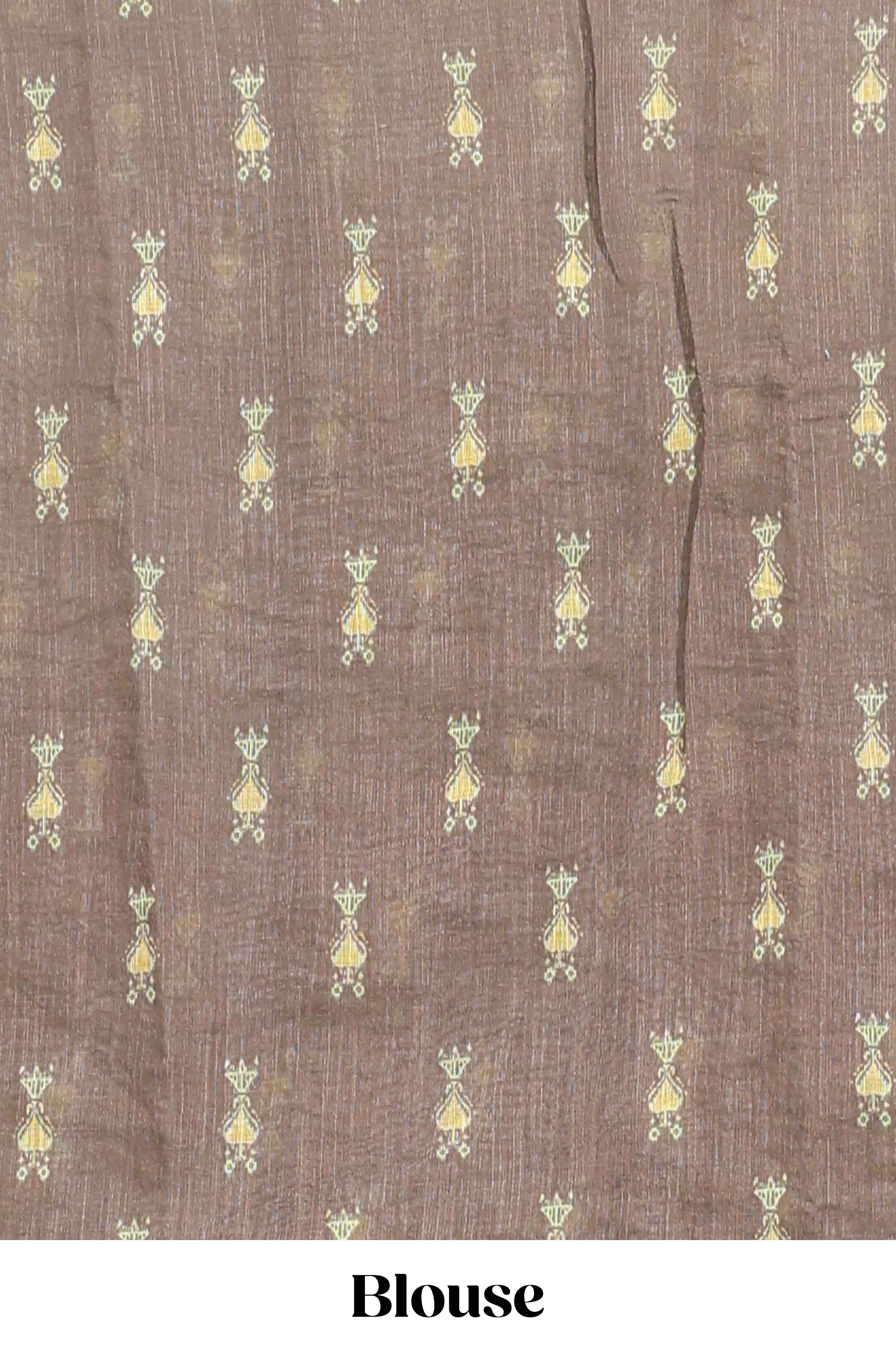 Green geometric ikkat design linen cotton saree with contrast zari border and printed blouse