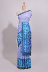 Blue geometric ikkat design linen cotton saree with contrast zari border and printed blouse