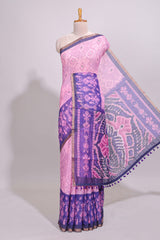Pink geometric ikkat design linen cotton saree with contrast zari border and printed blouse