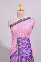Pink geometric ikkat design linen cotton saree with contrast zari border and printed blouse
